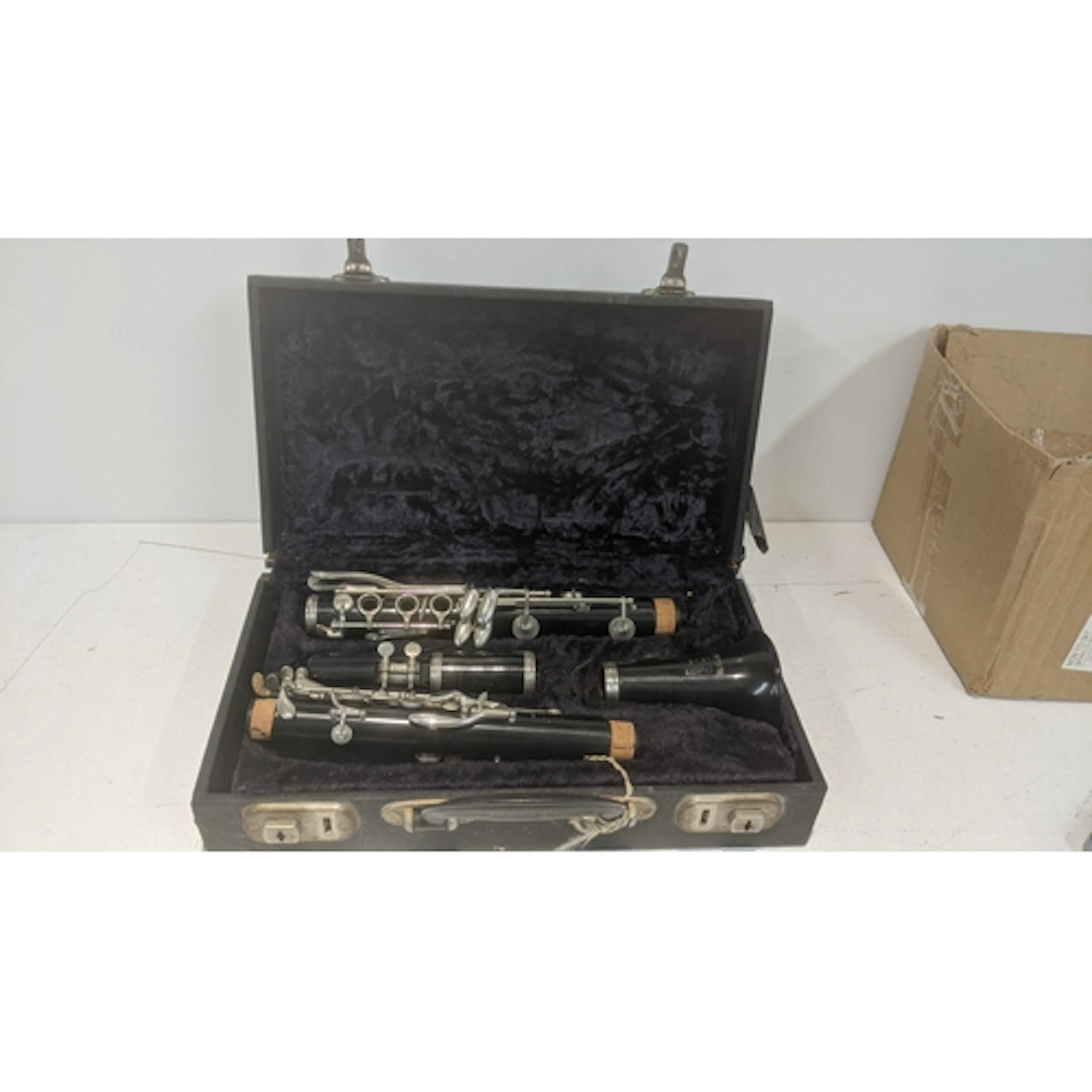A vintage Boosey and Hawkes Regent clarinet in a fitted case...