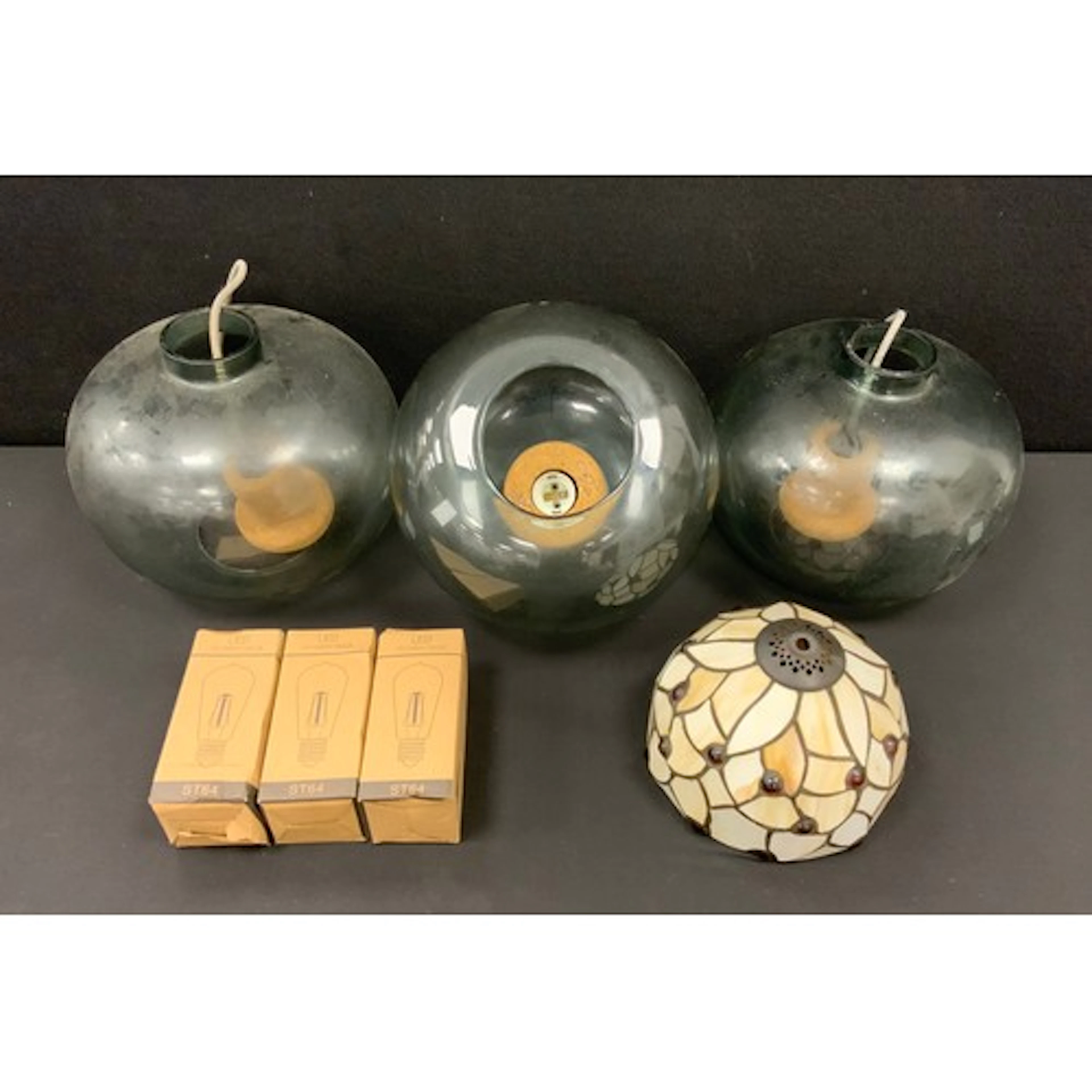 A trio of Danish Hubsch style cork and smoke glass pendant l...