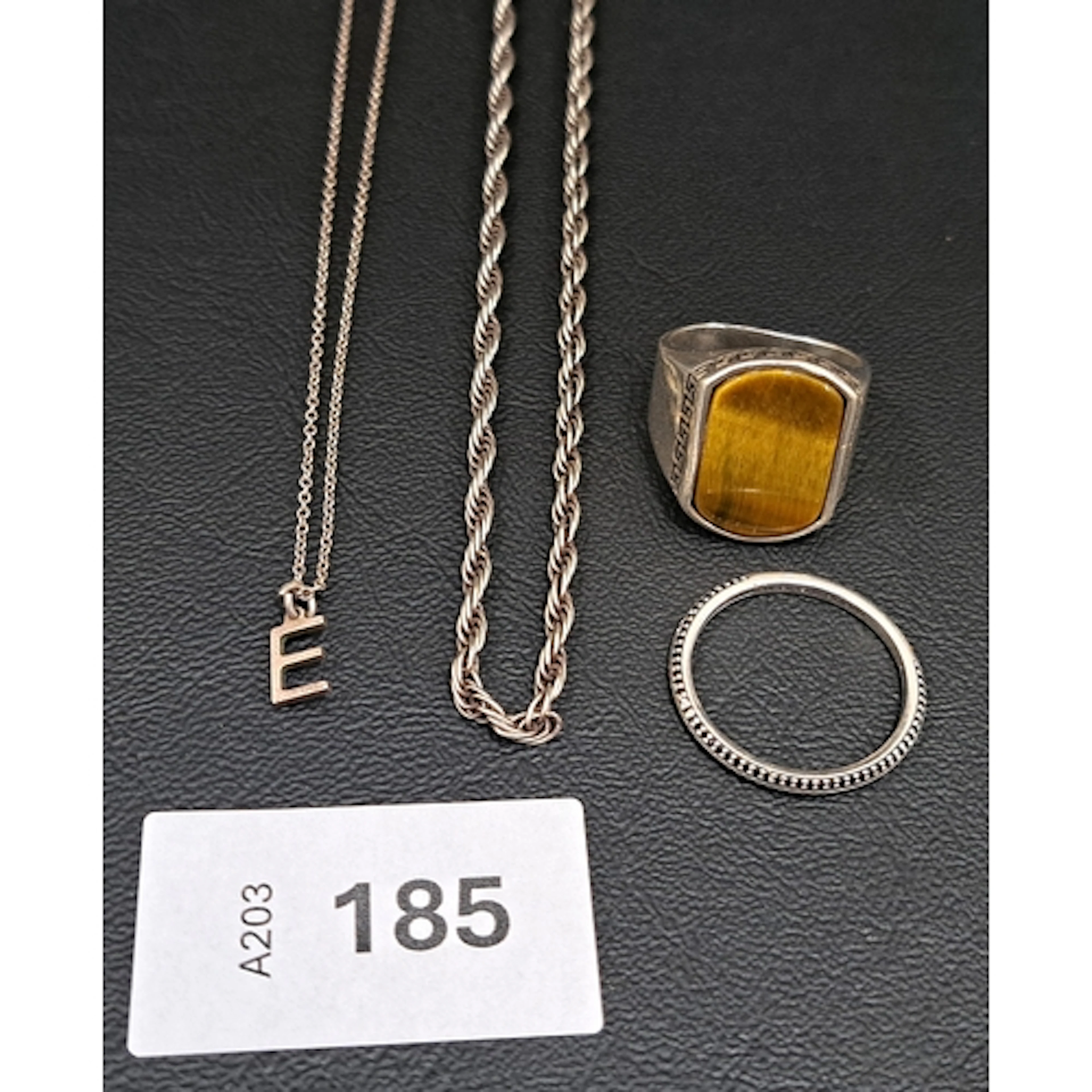 FOUR PIECES OF SILVER JEWELERY comprising a rope twist neck ...