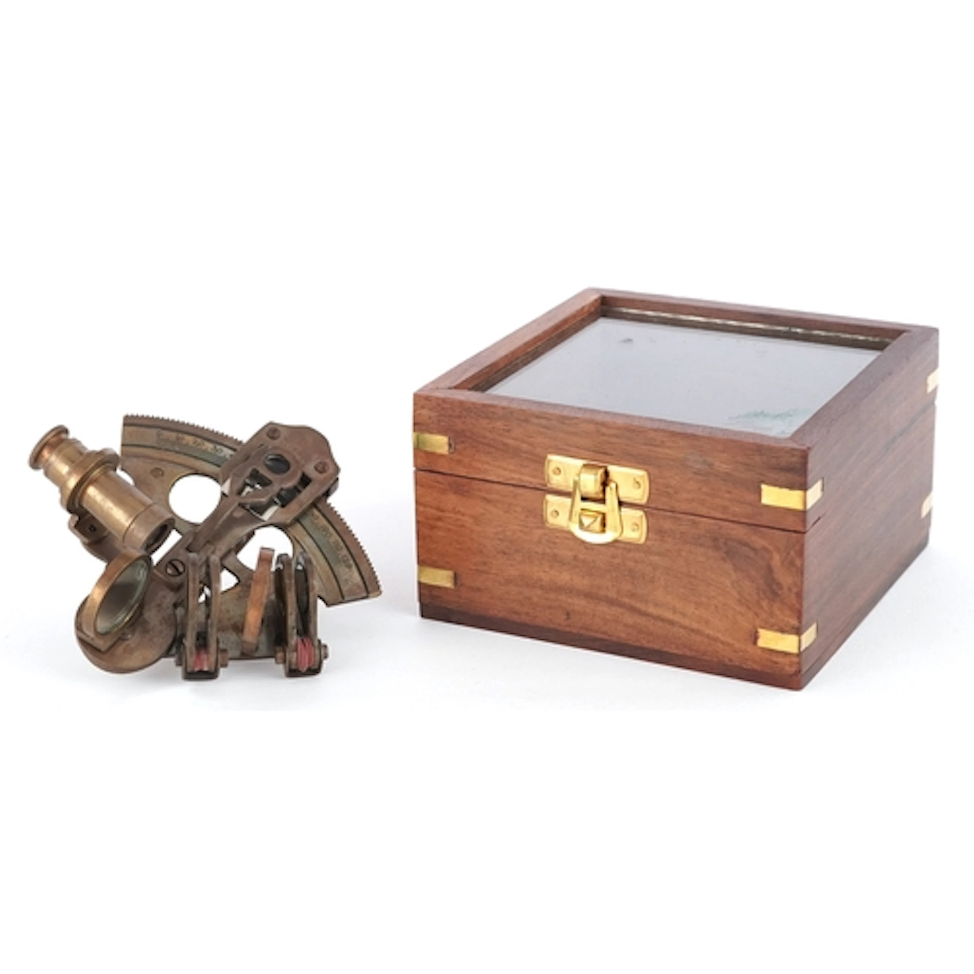 Shipping interest brass sextant housed in a glazed wooden di...