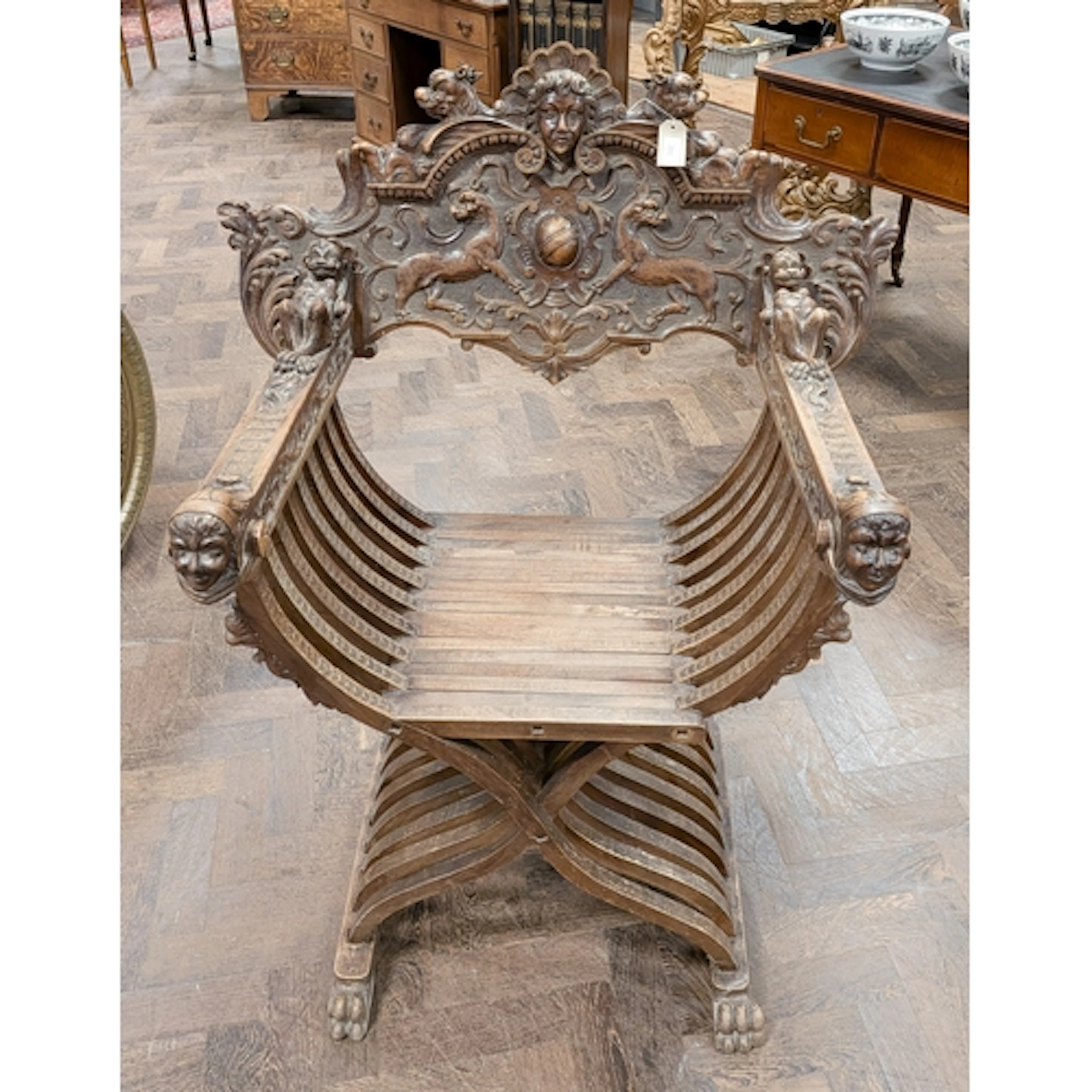 Italian Renaissance revival carved Savonarola chair, on fold...