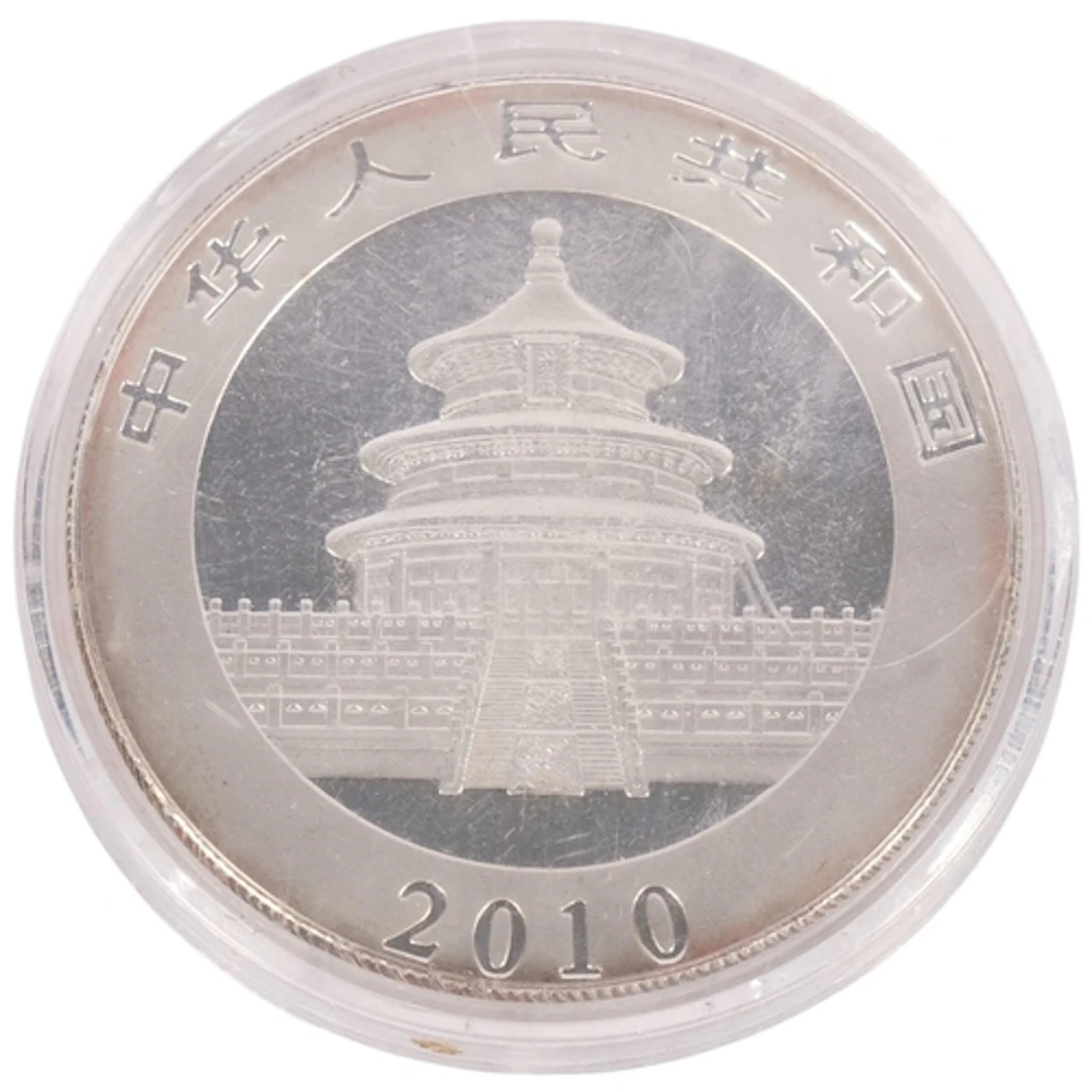 A 2010 Chinese 1oz 999 silver 10 yuan panda coin, in protect...