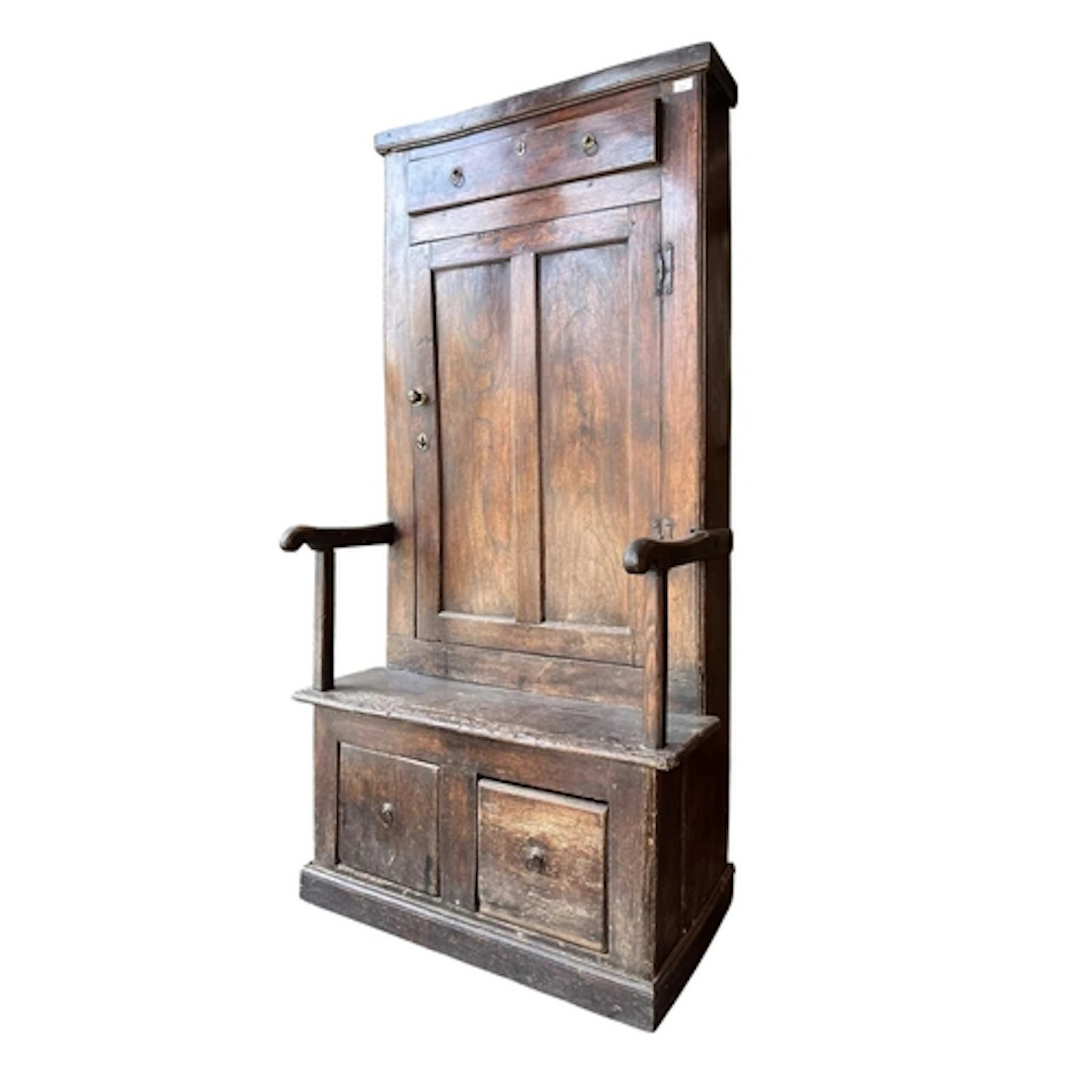 An 18th century oak wood hall 'bacon' settle. The settle hav...