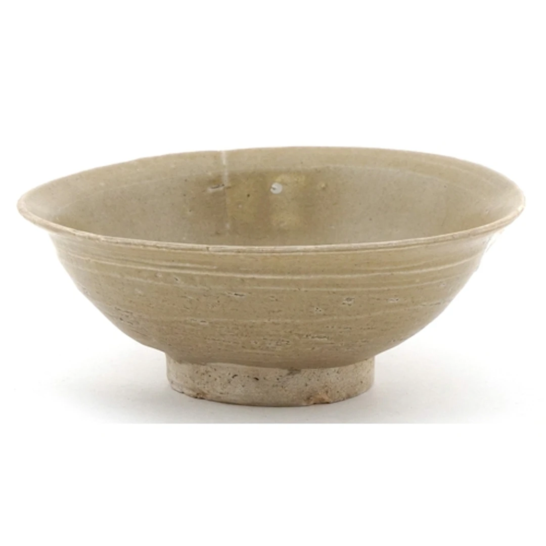 Chinese antique stoneware footed bowl with grey-green celado...