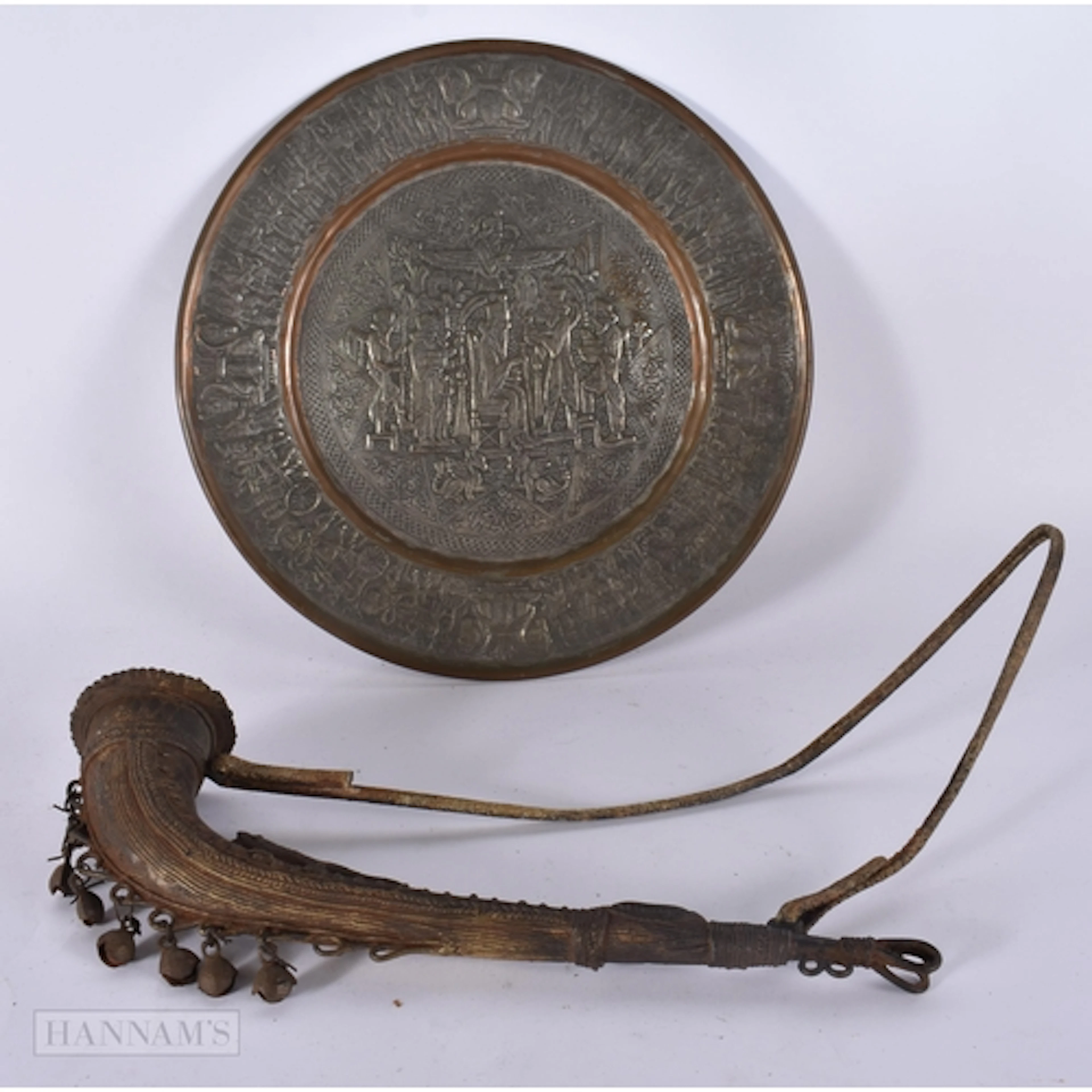 A MIDDLE EASTERN MIXED METAL PLATE and an unusual bronze ves...