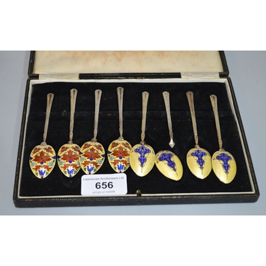 Two sets of four silver and enamel coffee spoons (one at fau...
