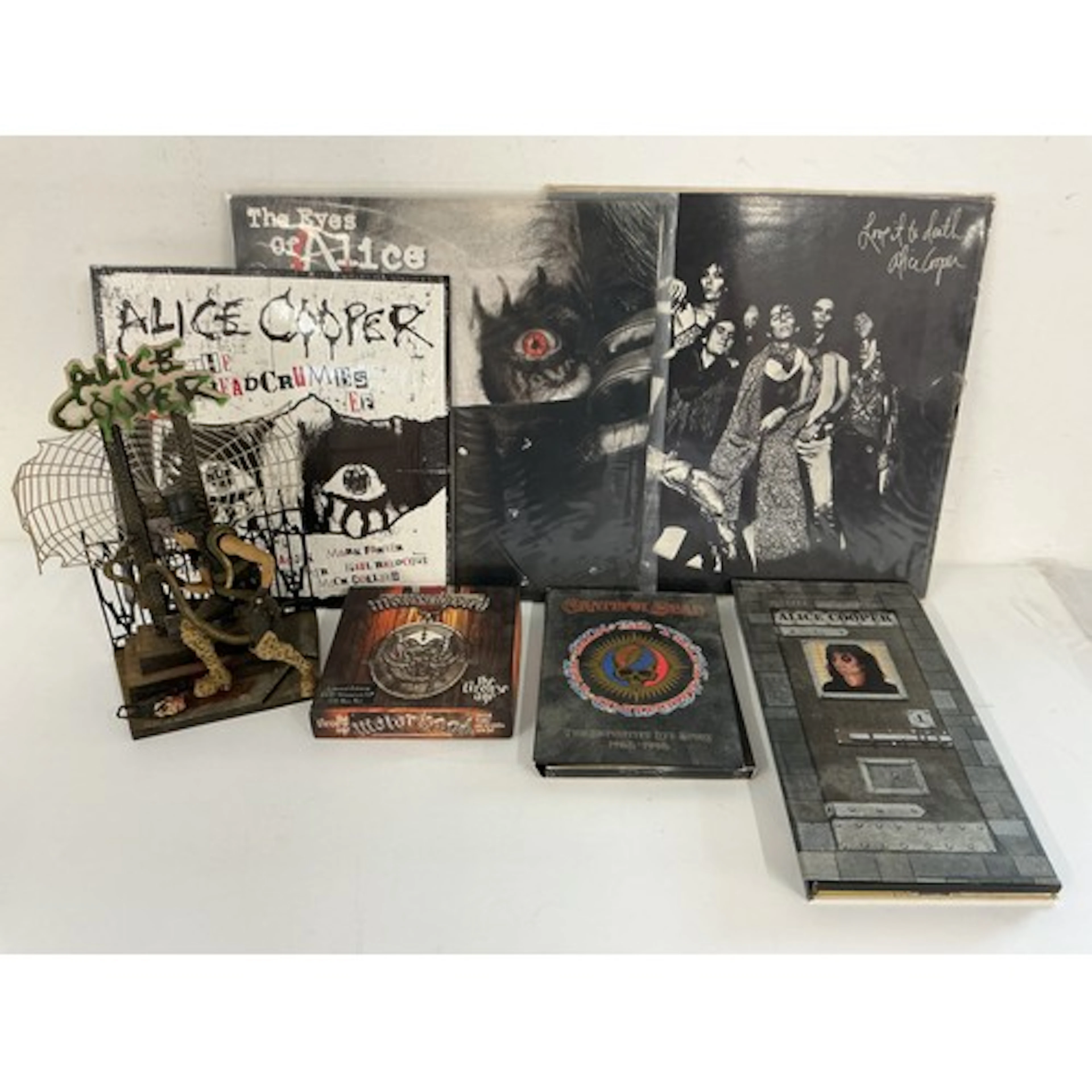 Two Alice Cooper LPs and a 10” EP plus a CD long box and Ali...