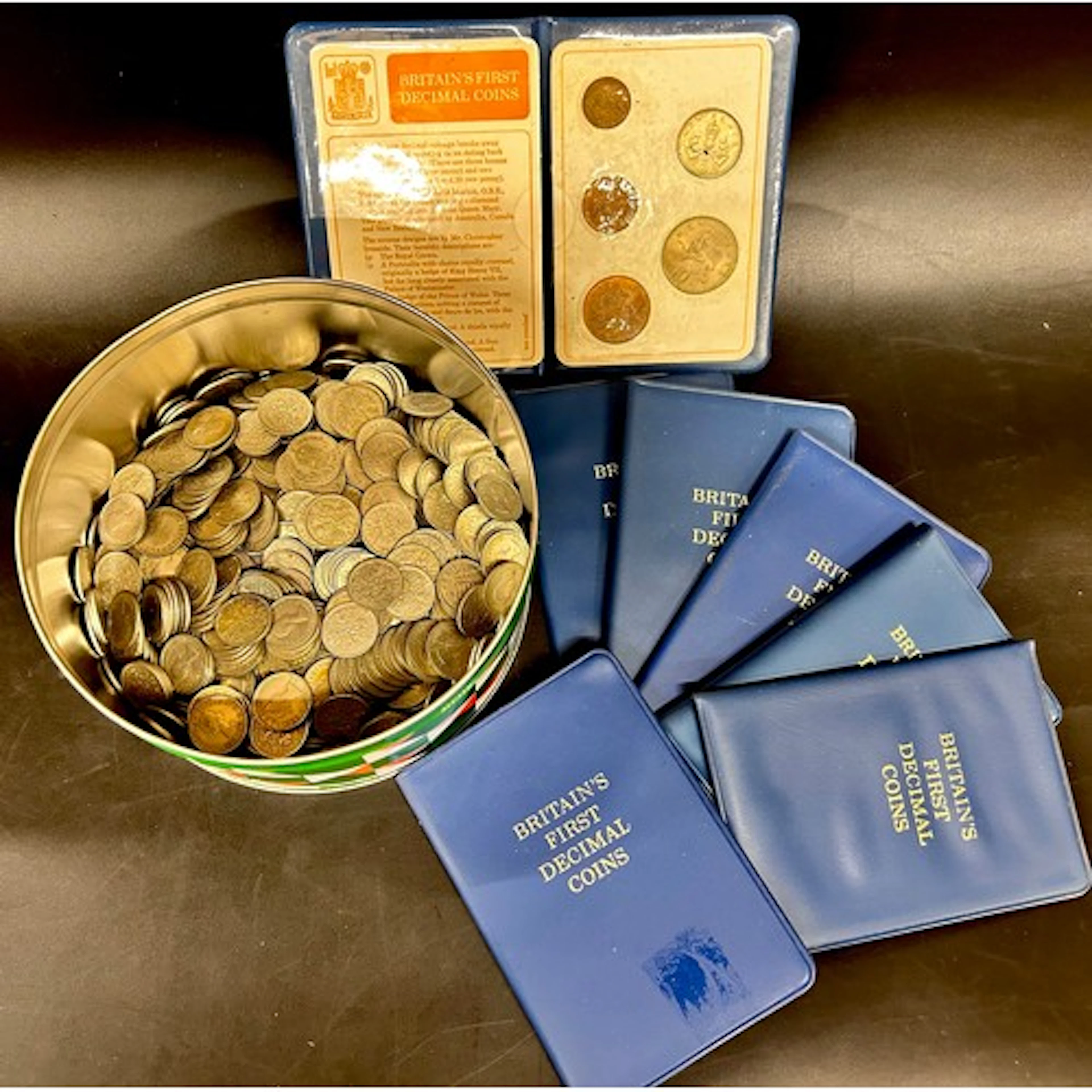 A large collection of sixpence coins and coin sets