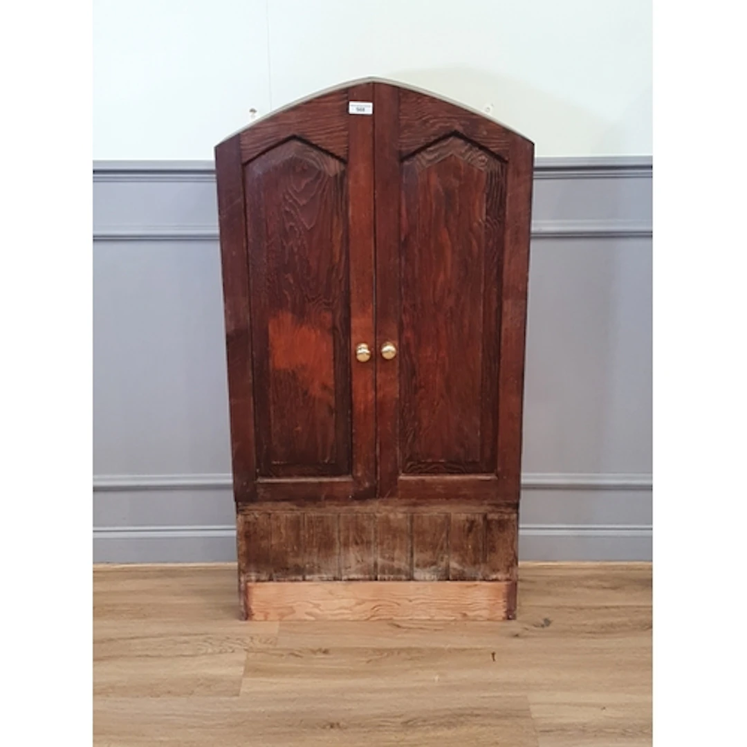 A large wall mounted Cupboard fitted pair of doors enclosing...