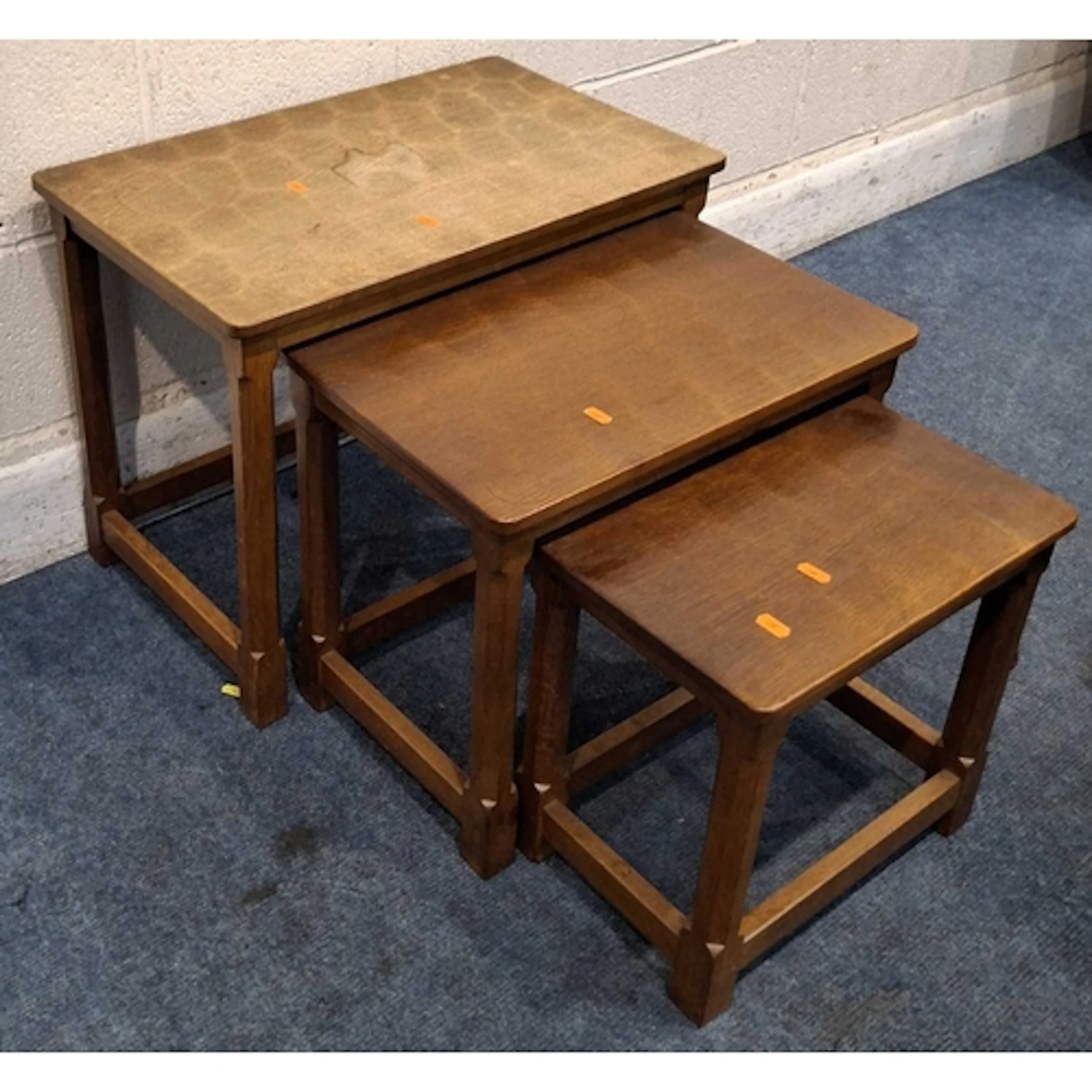 A ROBERT 'MOUSEMAN' THOMPSON OAK NEST OF THREE TABLES, with ...