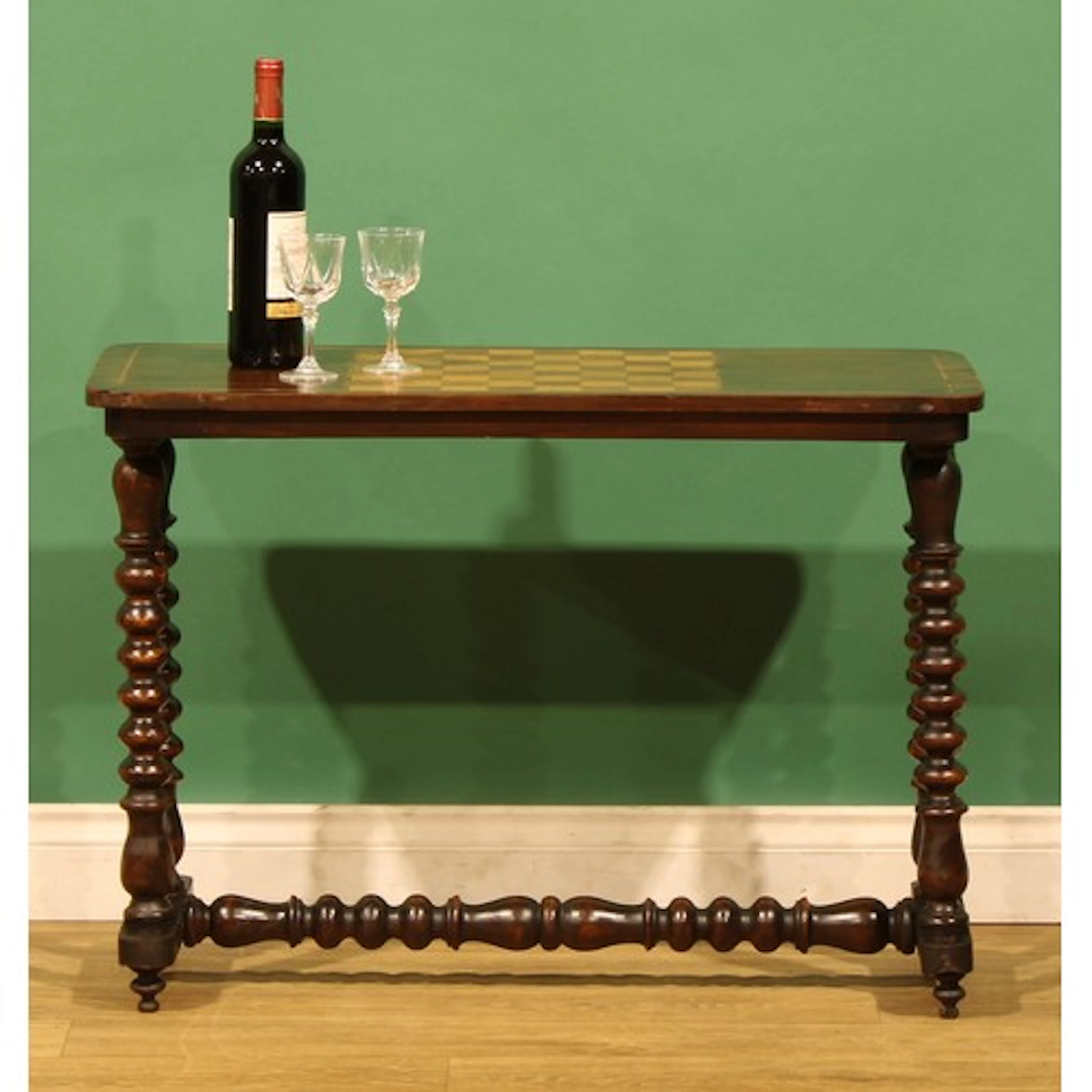 A late Victorian low drawing room games table, rounded recta...