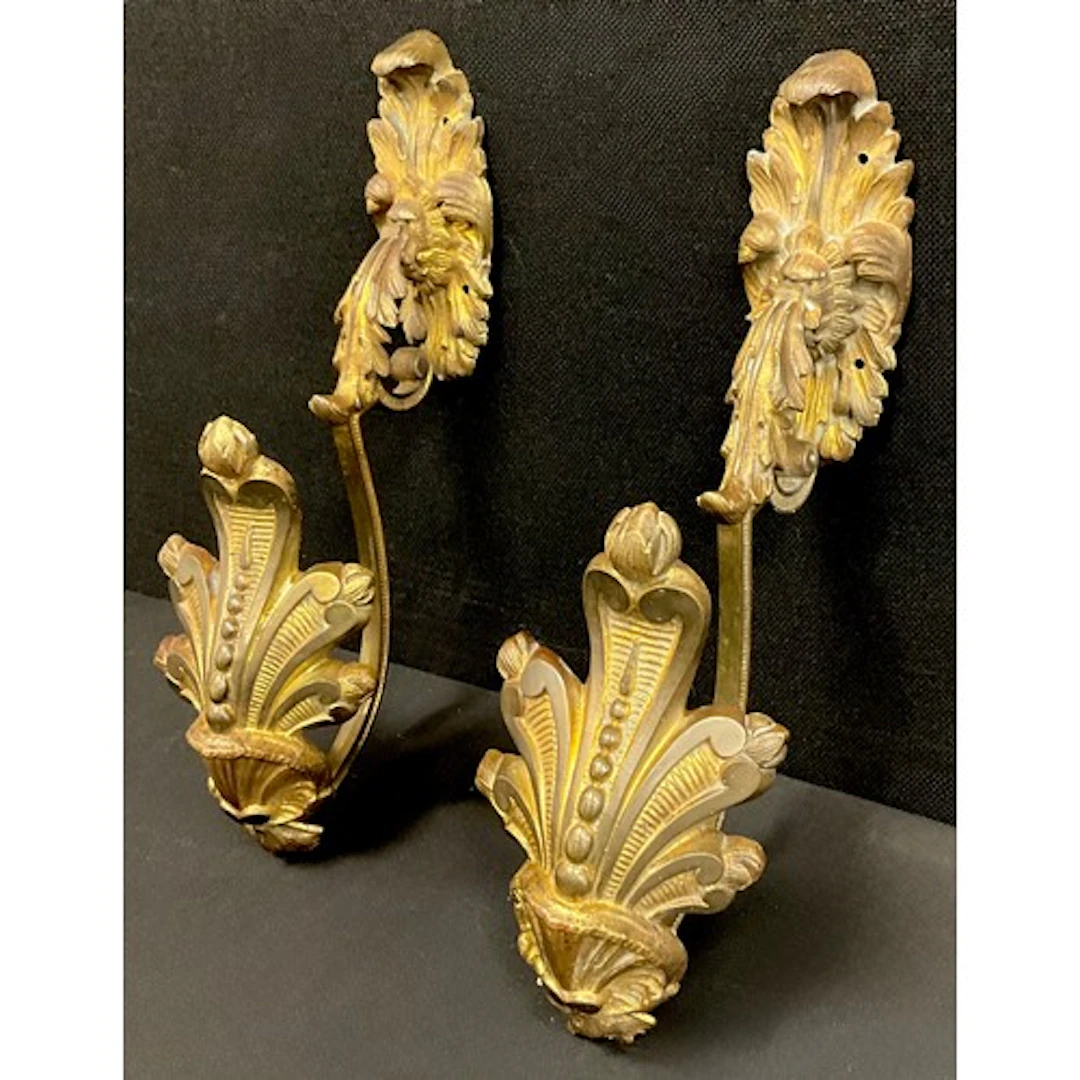 A pair of Rococo style gilt bronze curtain tie back hooks, o...