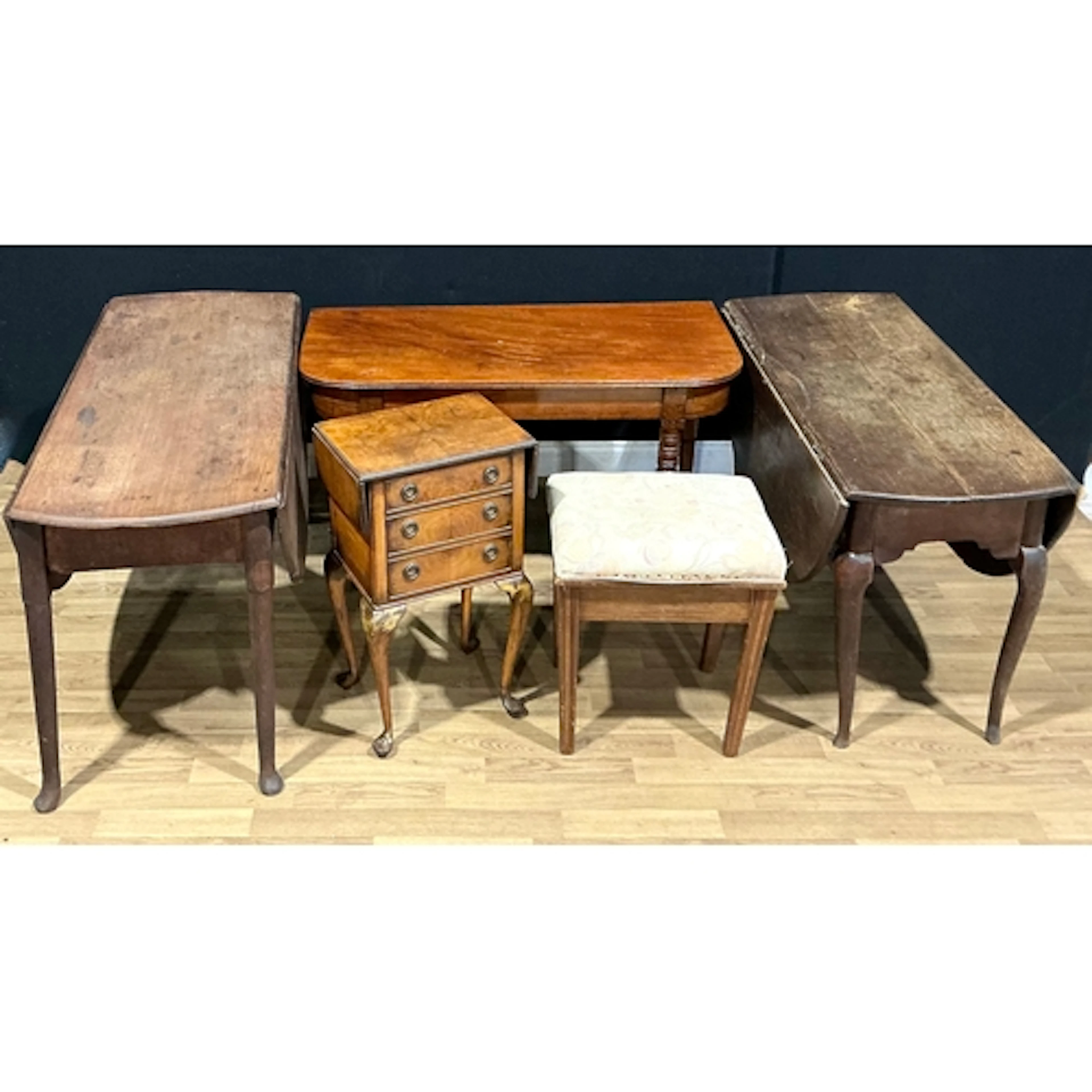 A George II oak dropleaf dining table; another; a George IV ...