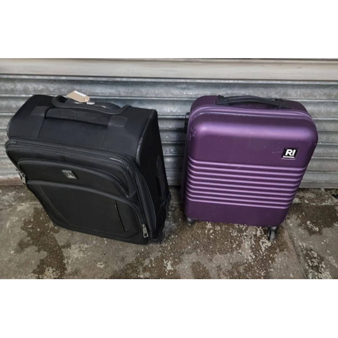 TWO SUITCASES INC. REVELATION, TRAVELPRO (ONE WHEEL MISSING)...
