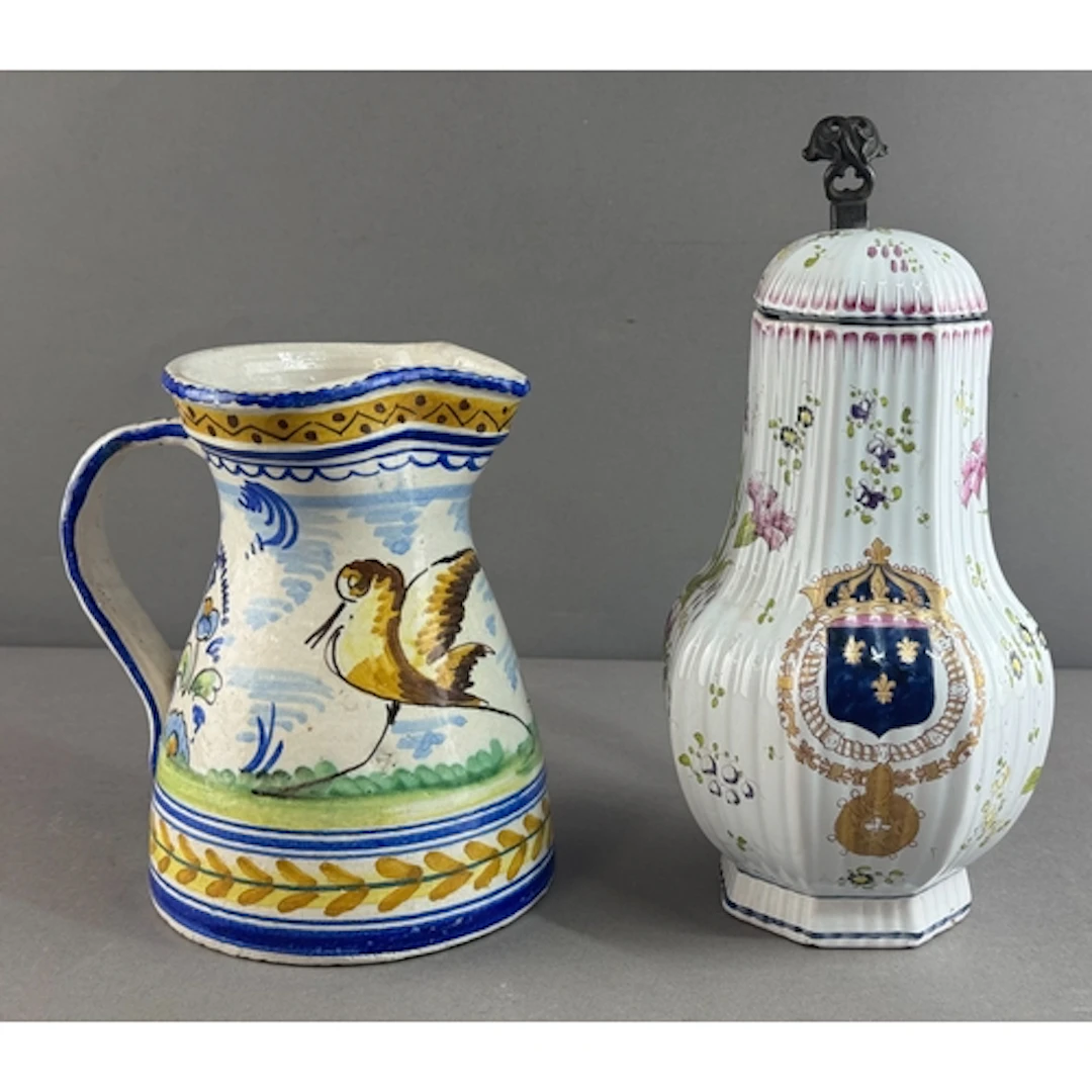 A French faïence armorial tankard and a faïence jug, late 19...