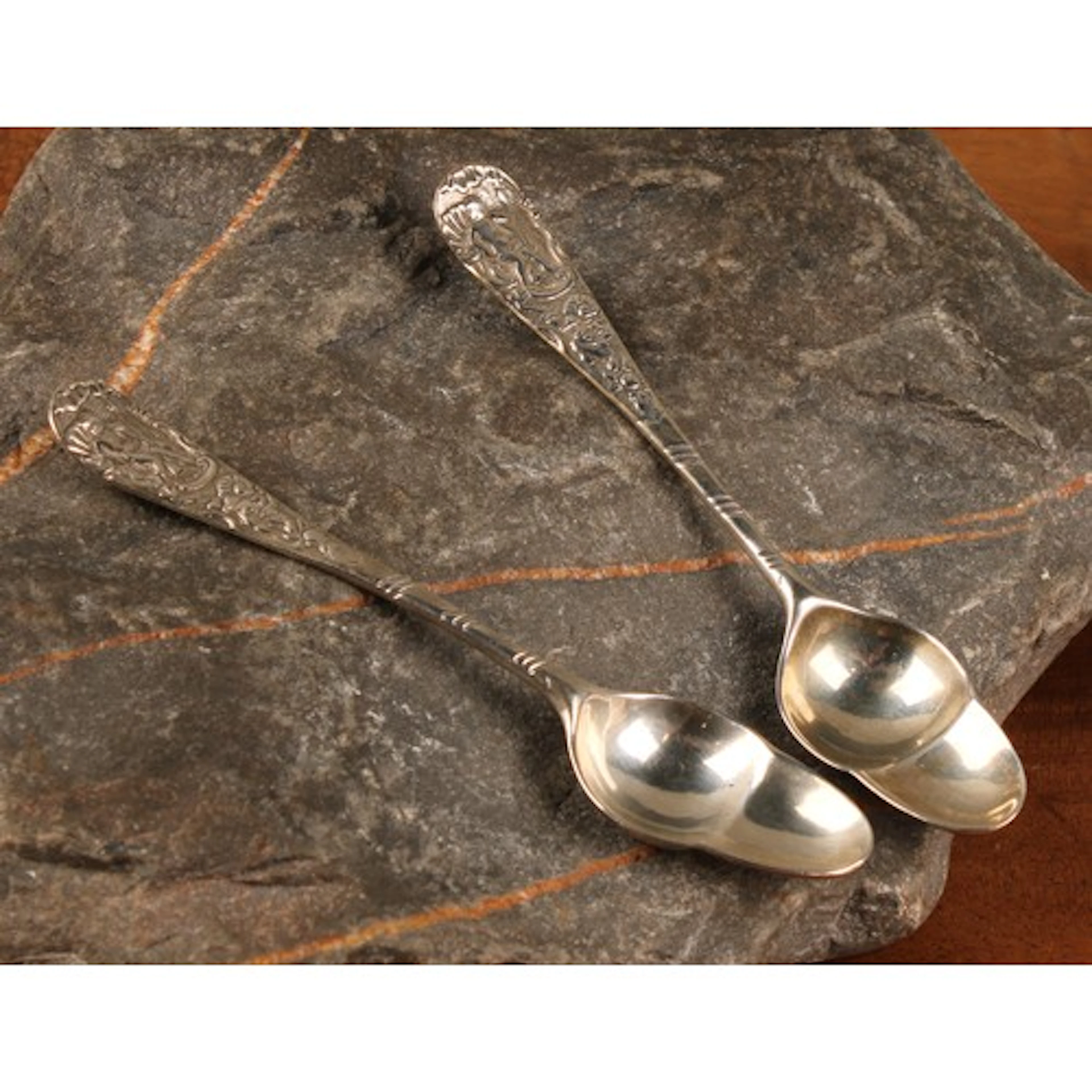 A pair of 18th century silver fancy back spoons, acorn shape...