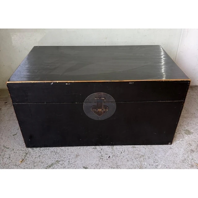 A black lacquer style trunk with handles to sides. Height 40...