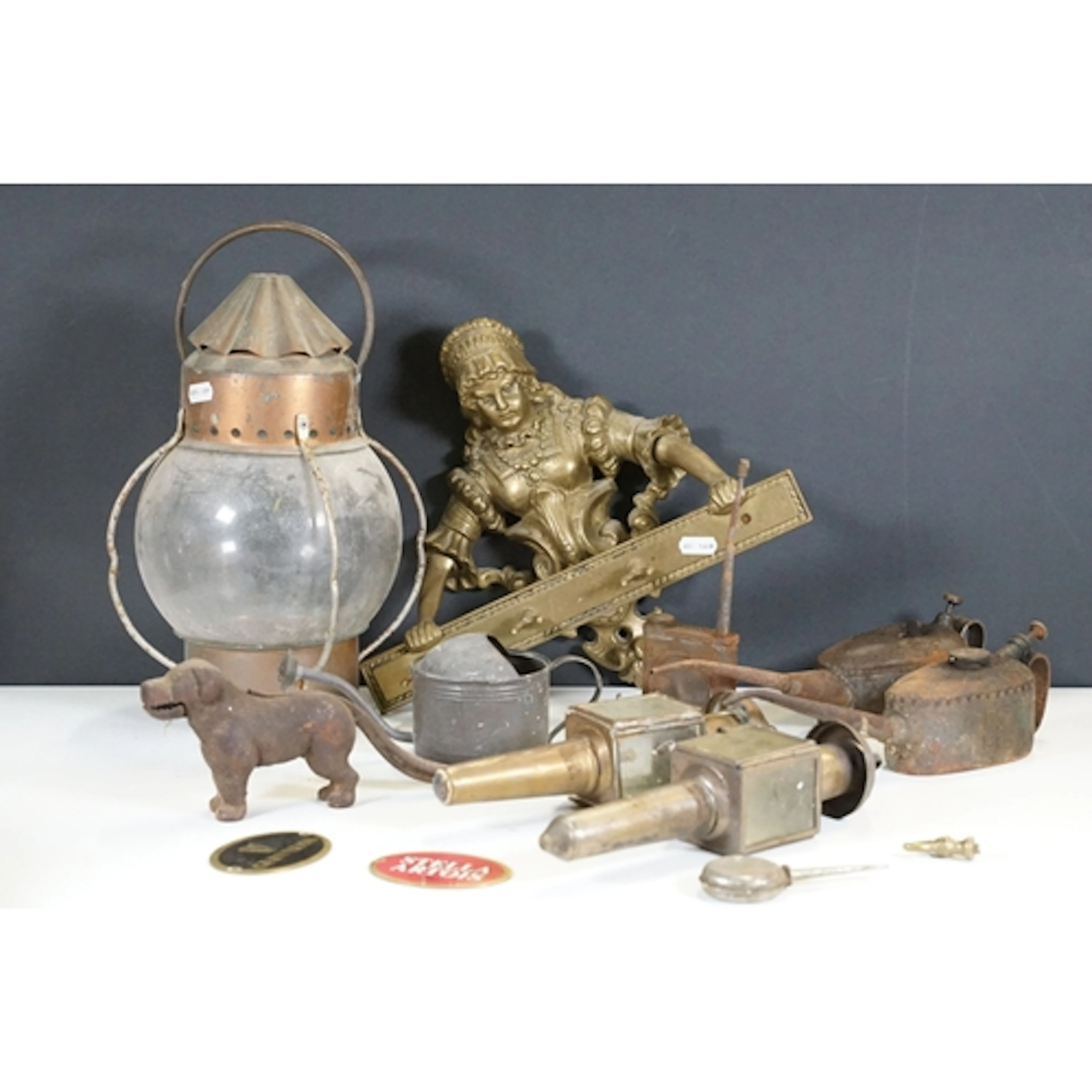 Antique brass figural set of hooks, in the form of a lady ho...
