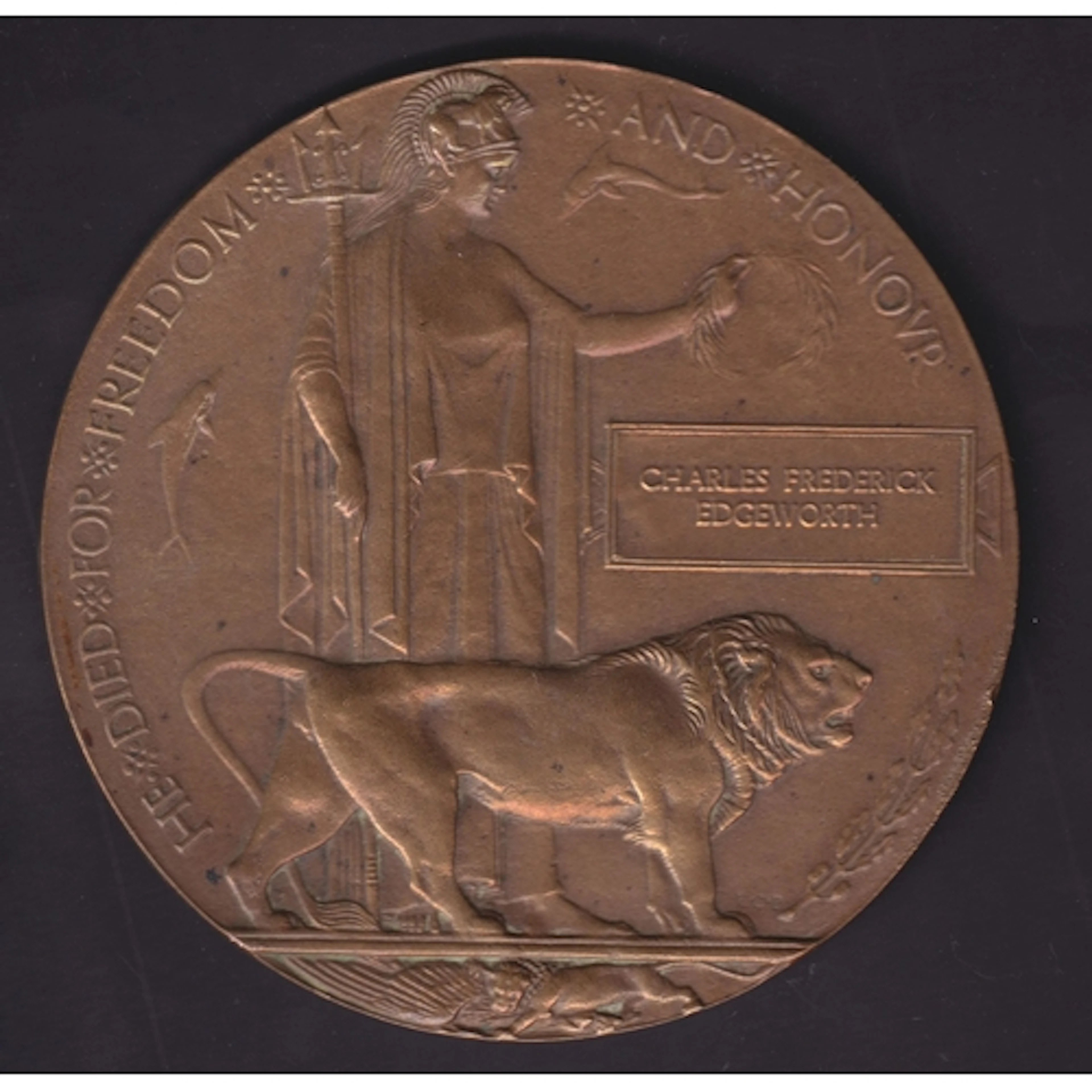 A WWI bronze memorial plaque/death penny named to Charles Fr...