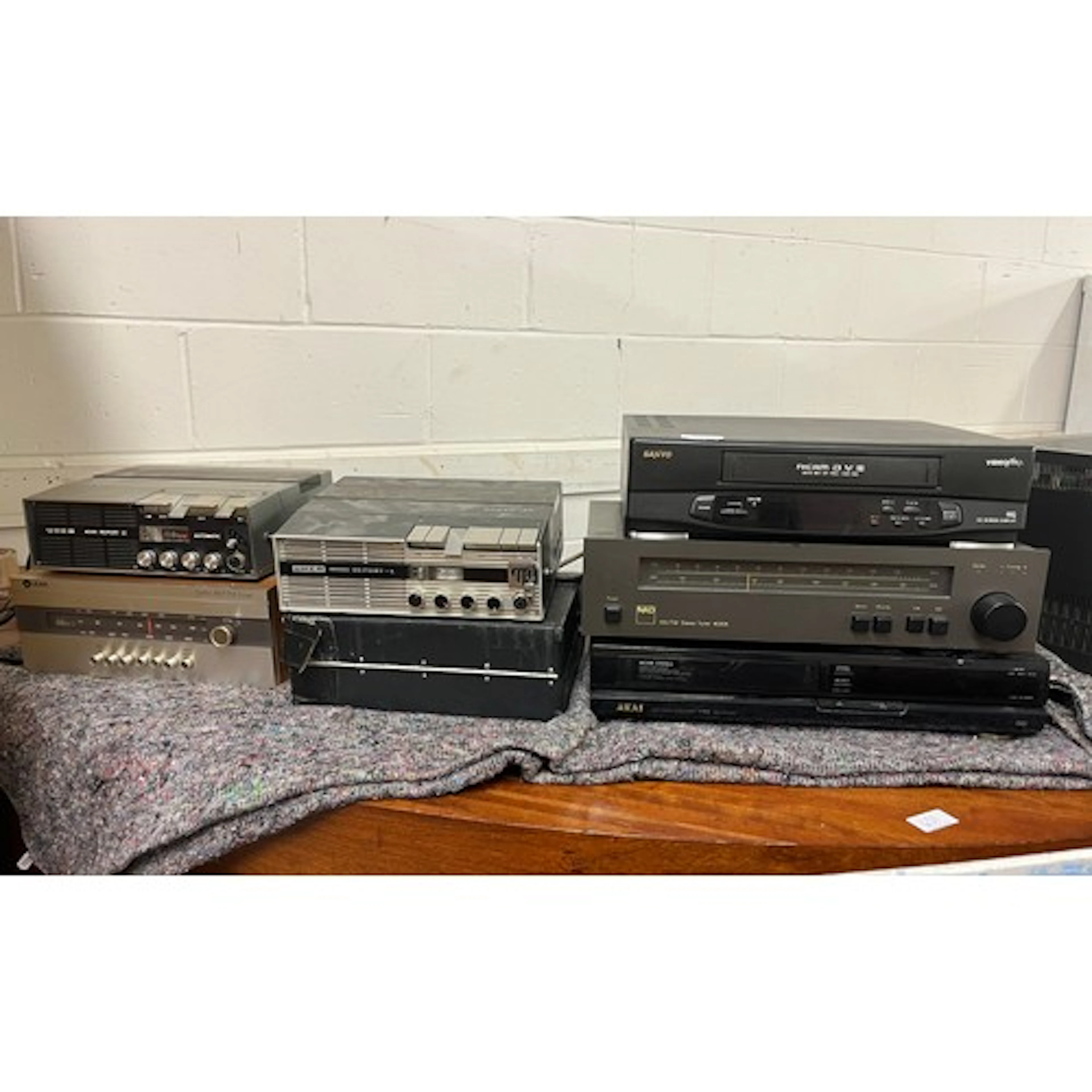 DVD player, Sanyo video tape, NAD stereo, Akai video cassett...