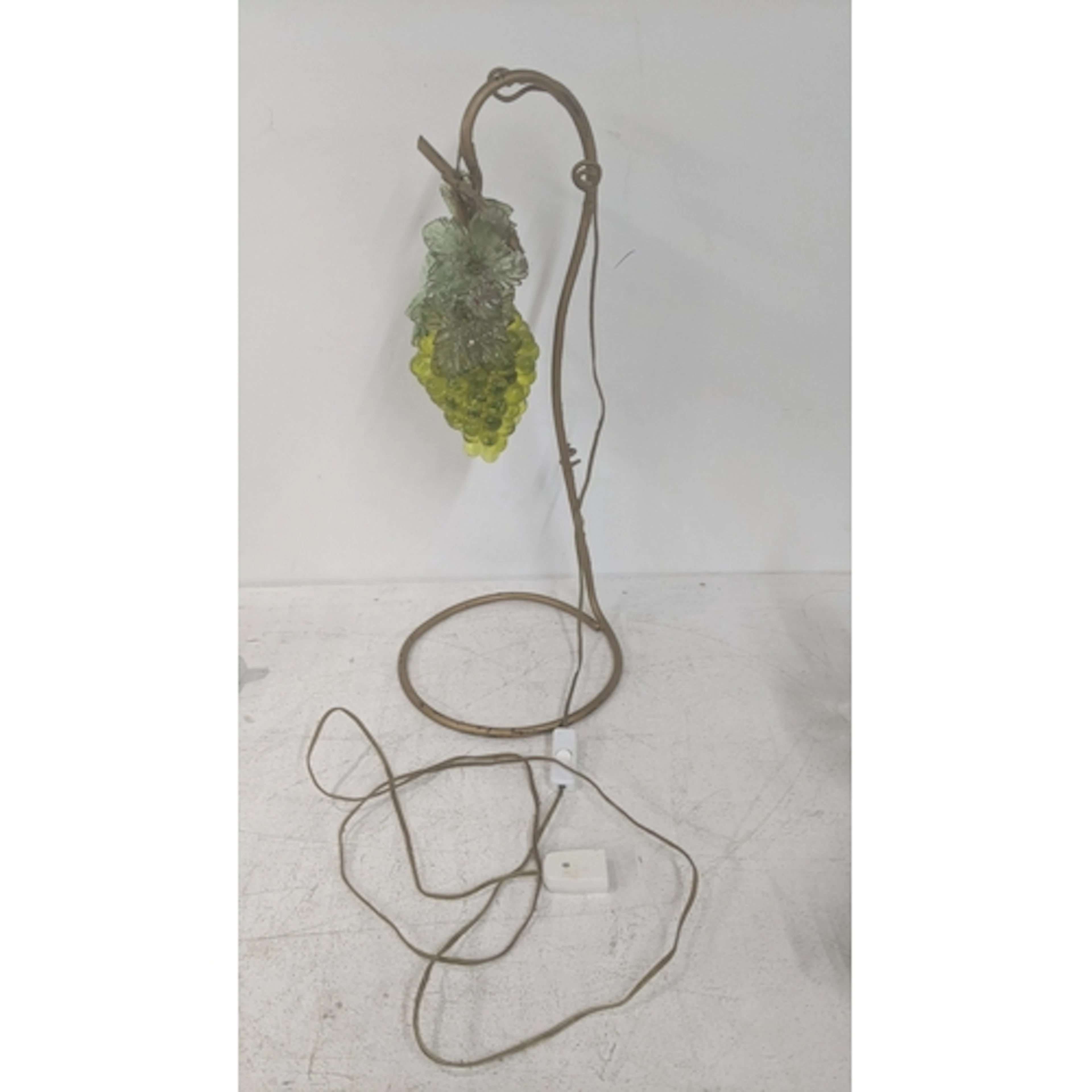A Murano style lamp having a glass shade fashioned as a bunc...