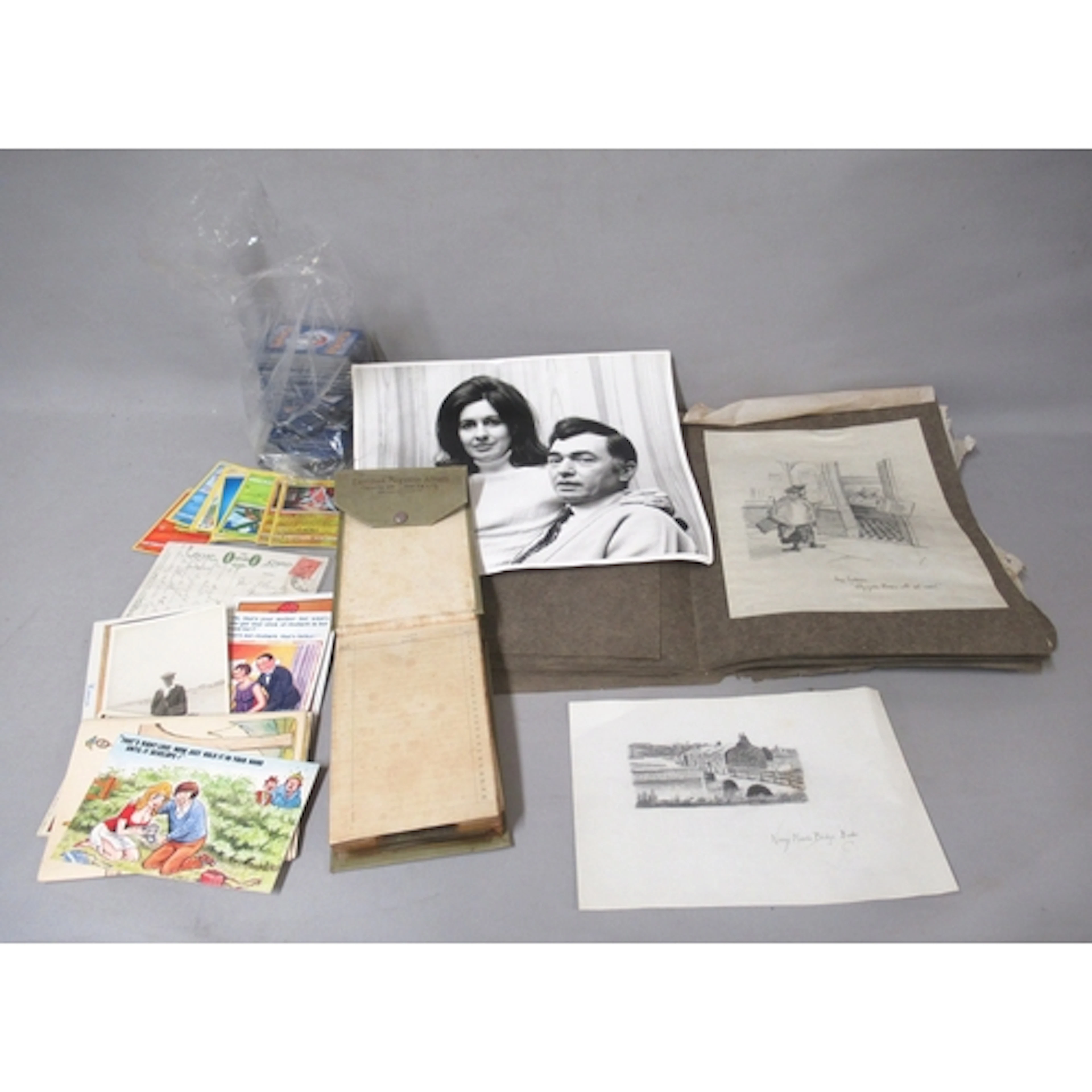 Box containing a quantity of loose postcards, an album of po...
