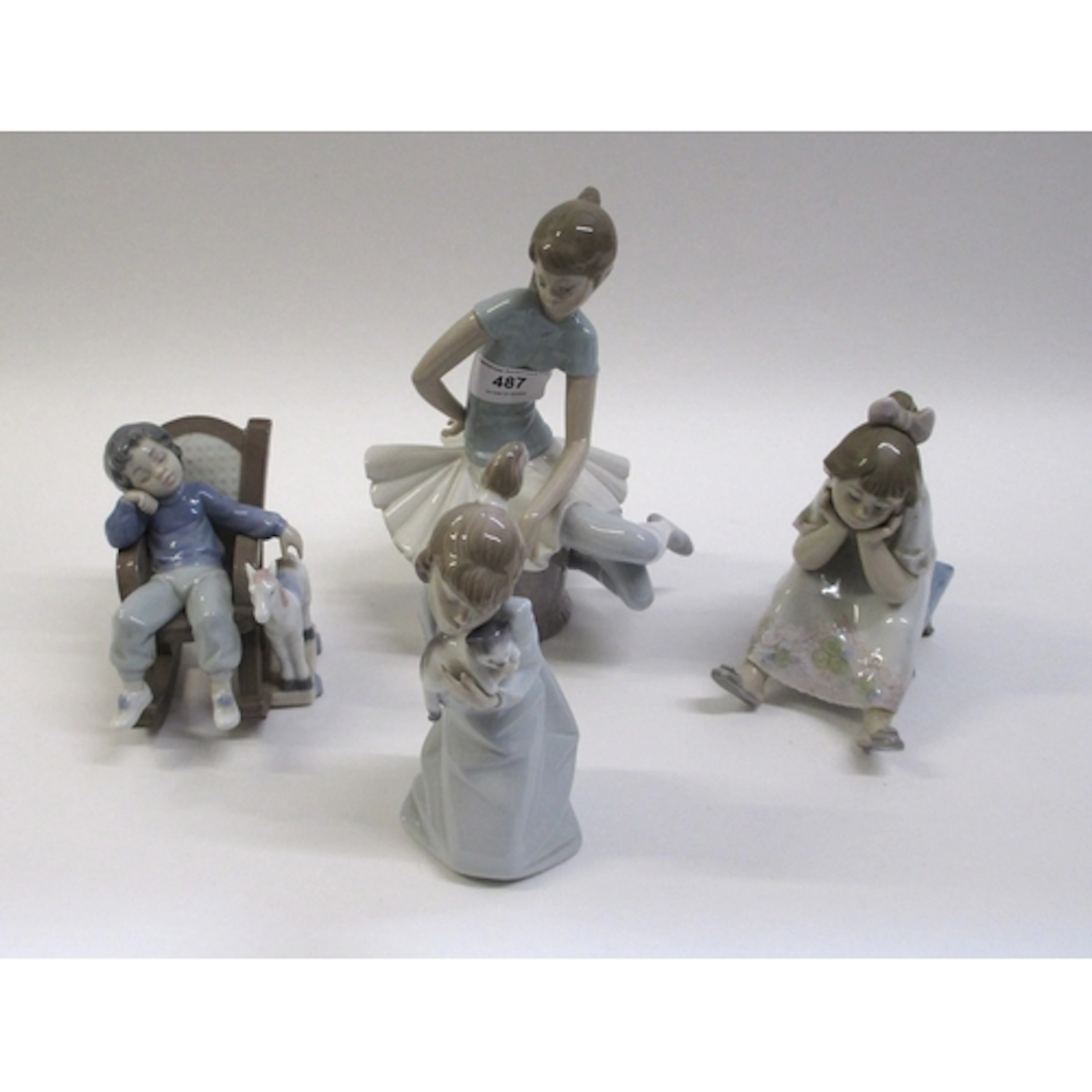 Four various Lladro figures of children, unboxed