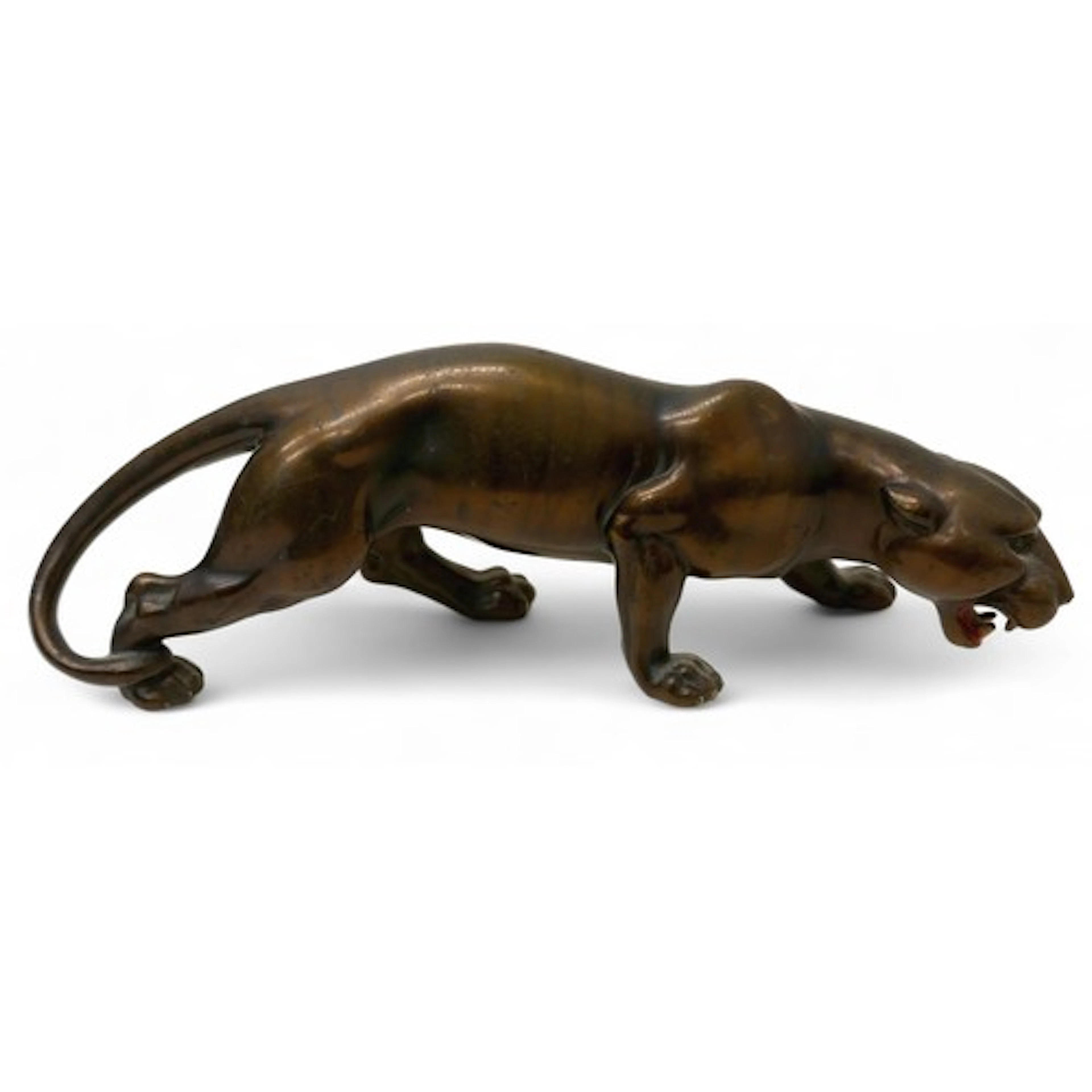 A bronzed metal sculpture, modelled as a prowling panther, e...