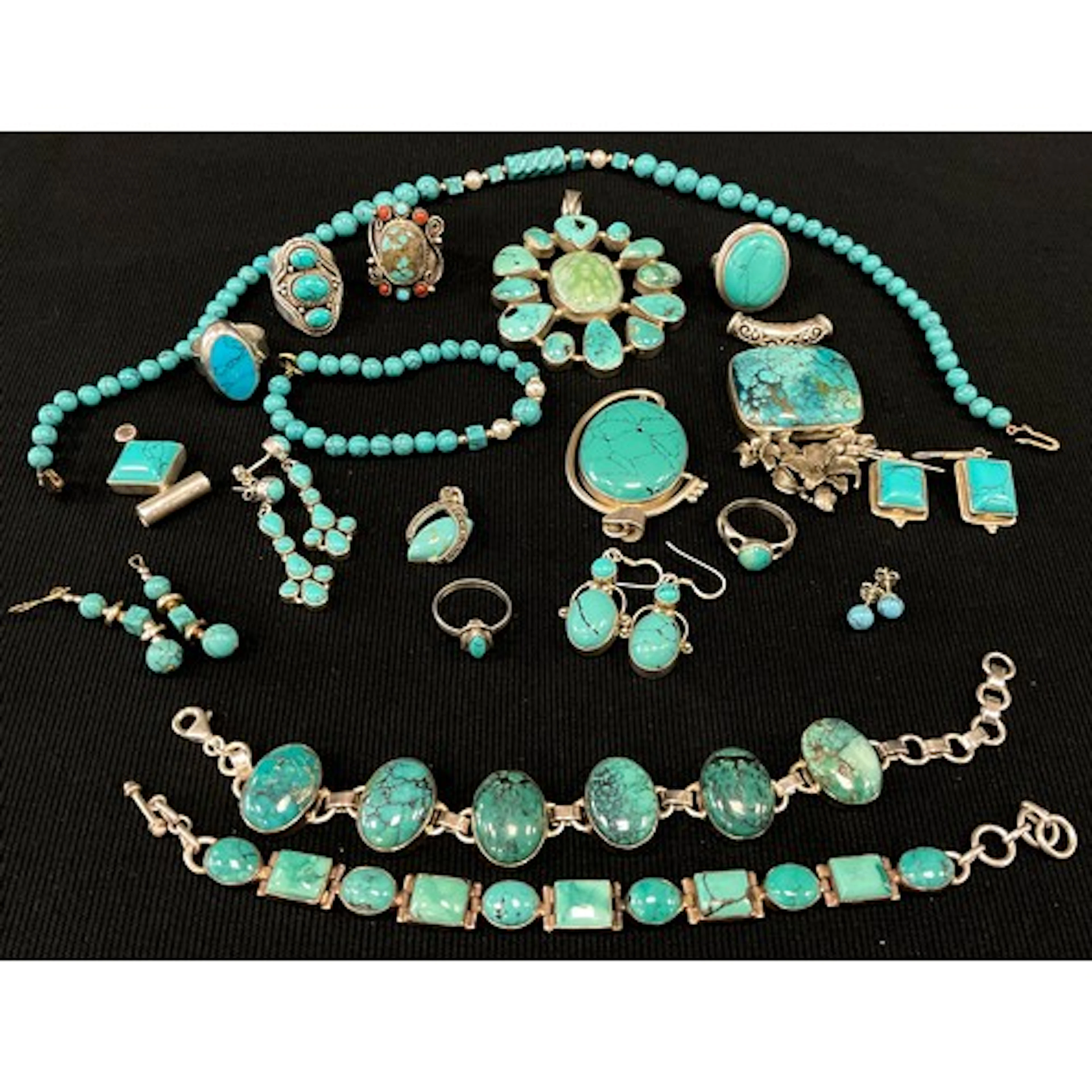A Navajo inspired pendant, the unmarked silver metal mount i...
