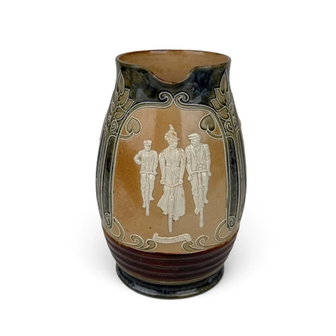 A DOULTON LAMBETH STONEWARE CLYCLING JUG, CIRCA 1900 Designe...