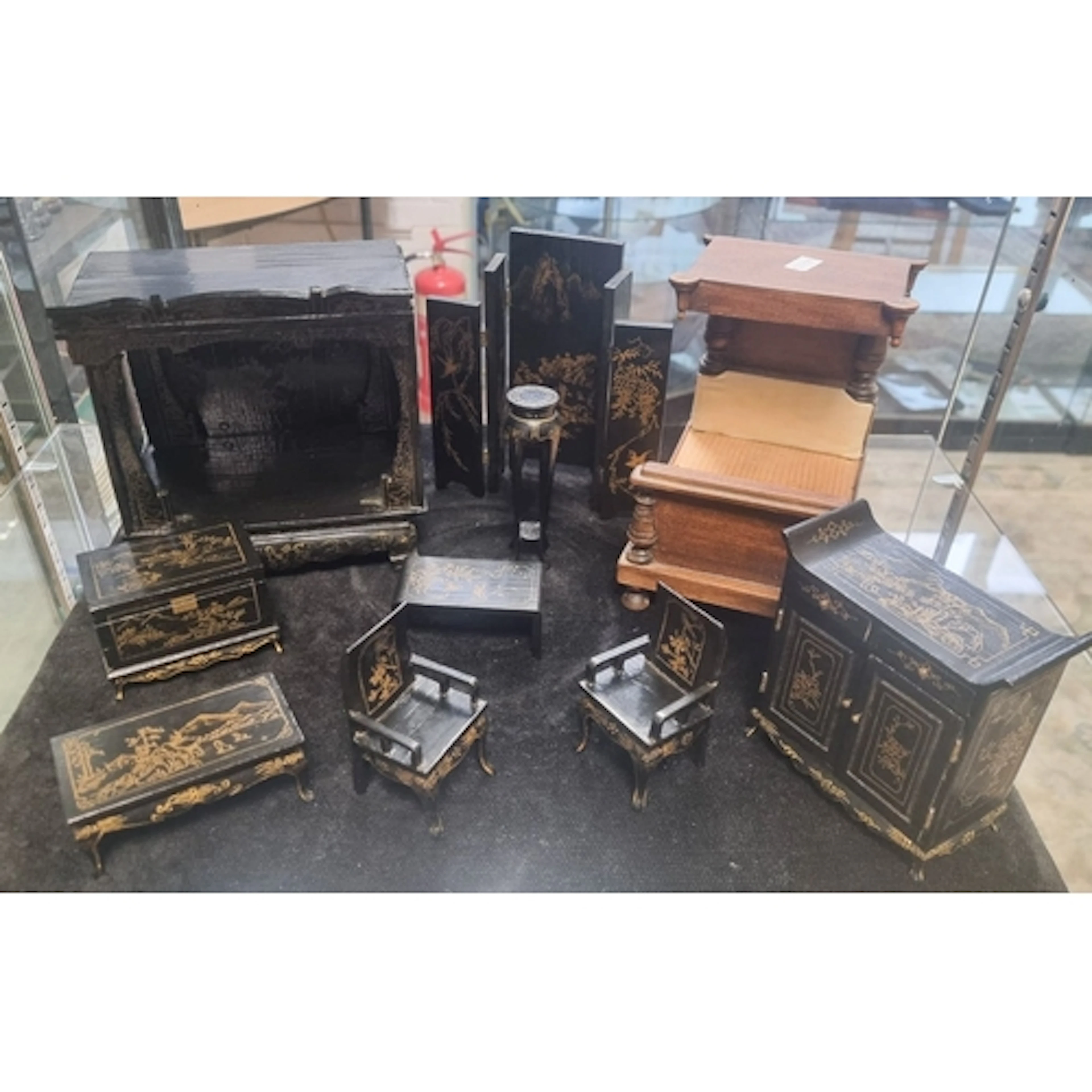A small quantity of miniature Chinese black lacquered dolls ...
