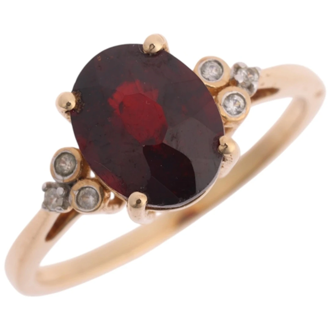 A 9ct gold garnet and white sapphire ring, Gemporia, Birming...