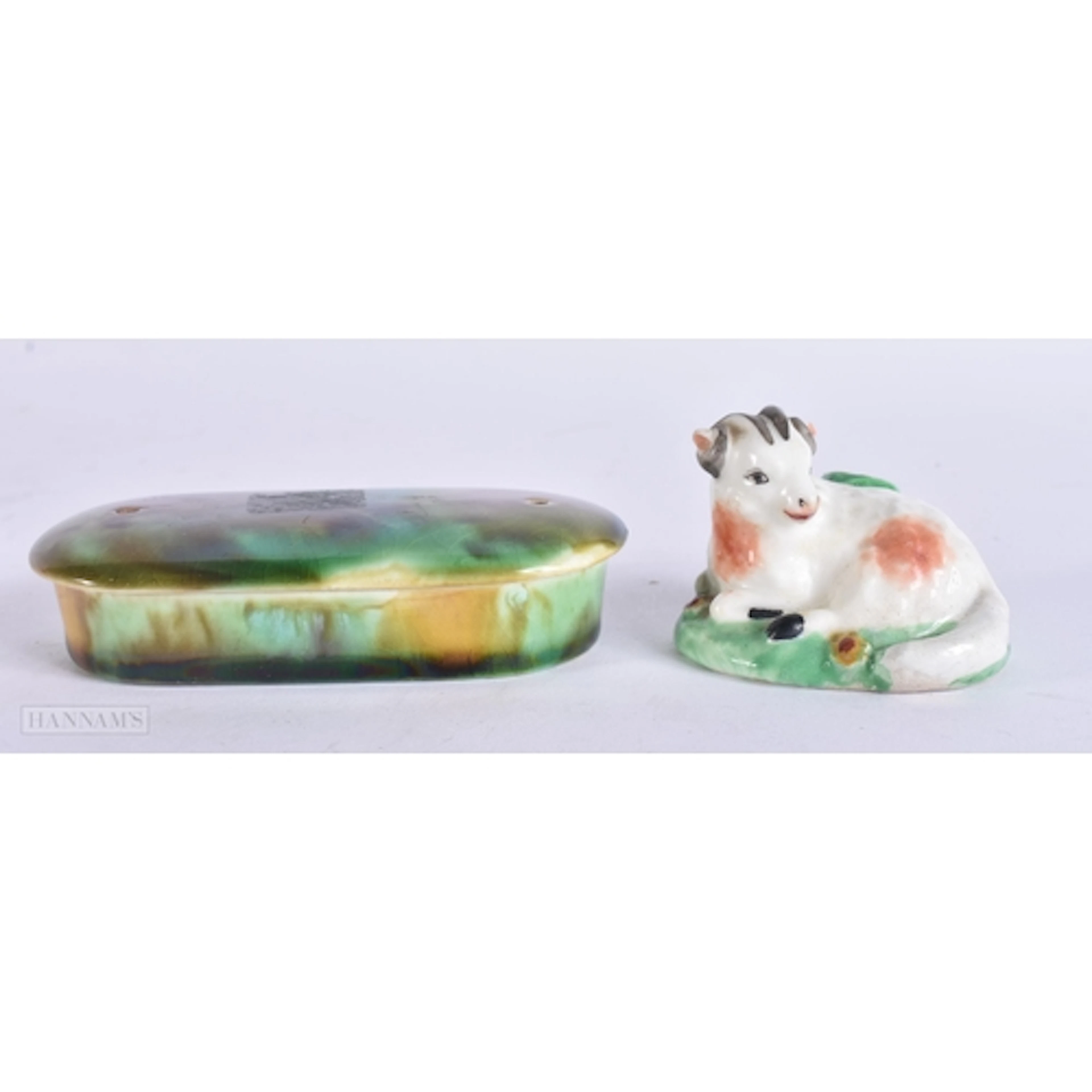 AN 18TH CENTURY DERBY PORCELAIN FIGURE OF A SHEEP together w...