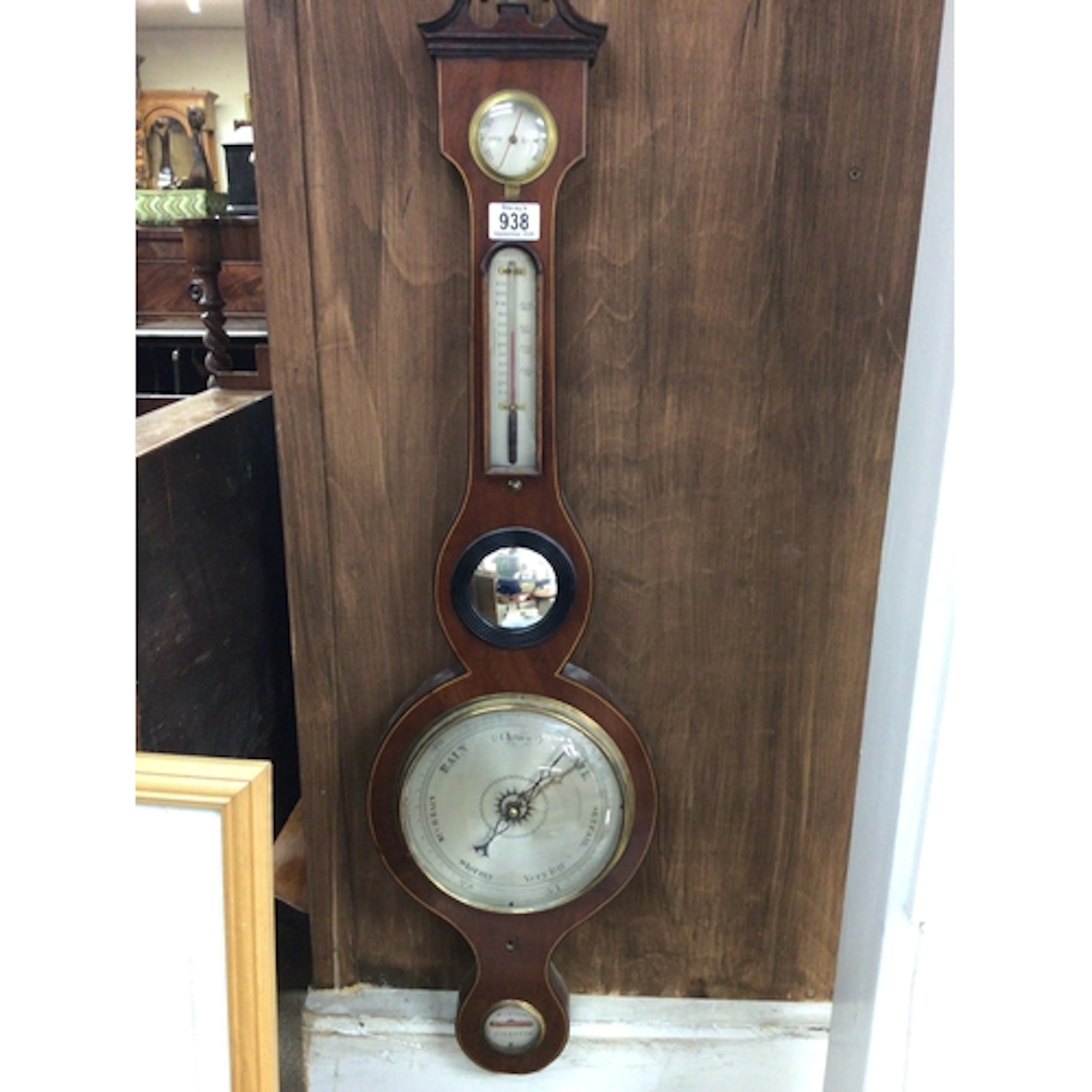 A late George III banjo barometer with silvered dial mercury...