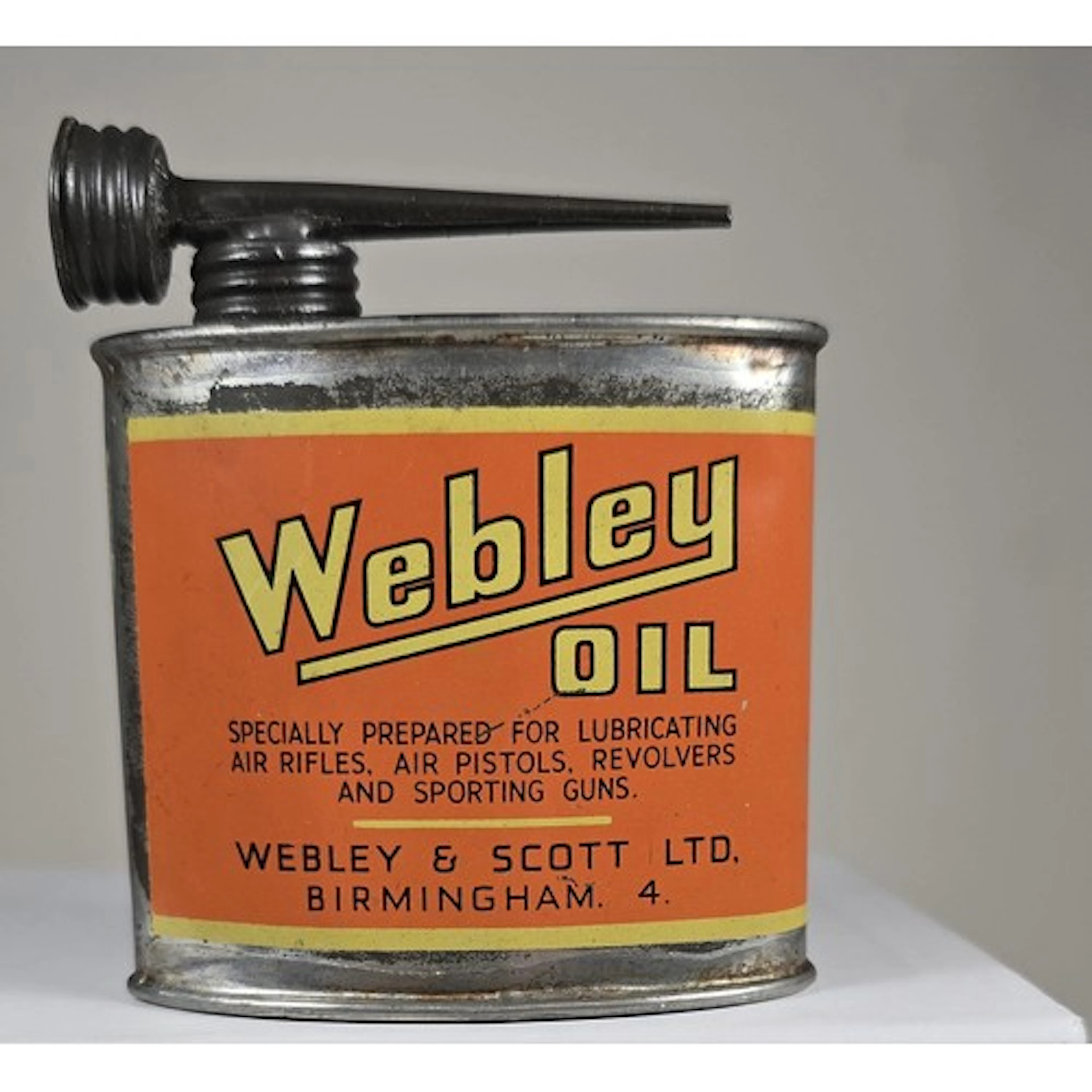 A good rare pre-war Webley oval orange Oil Can , with screw-...