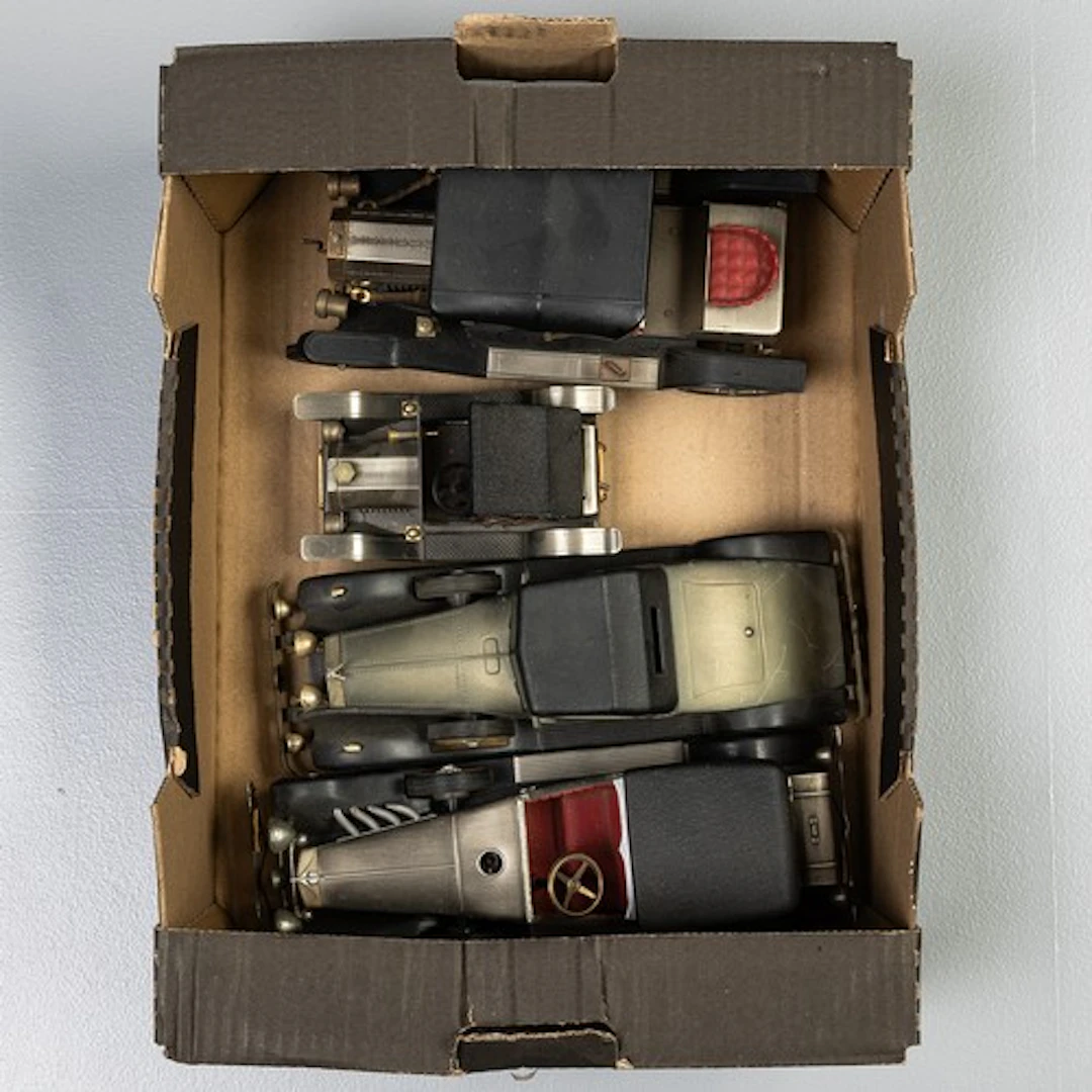 Four metal vintage cars thought to be radios.