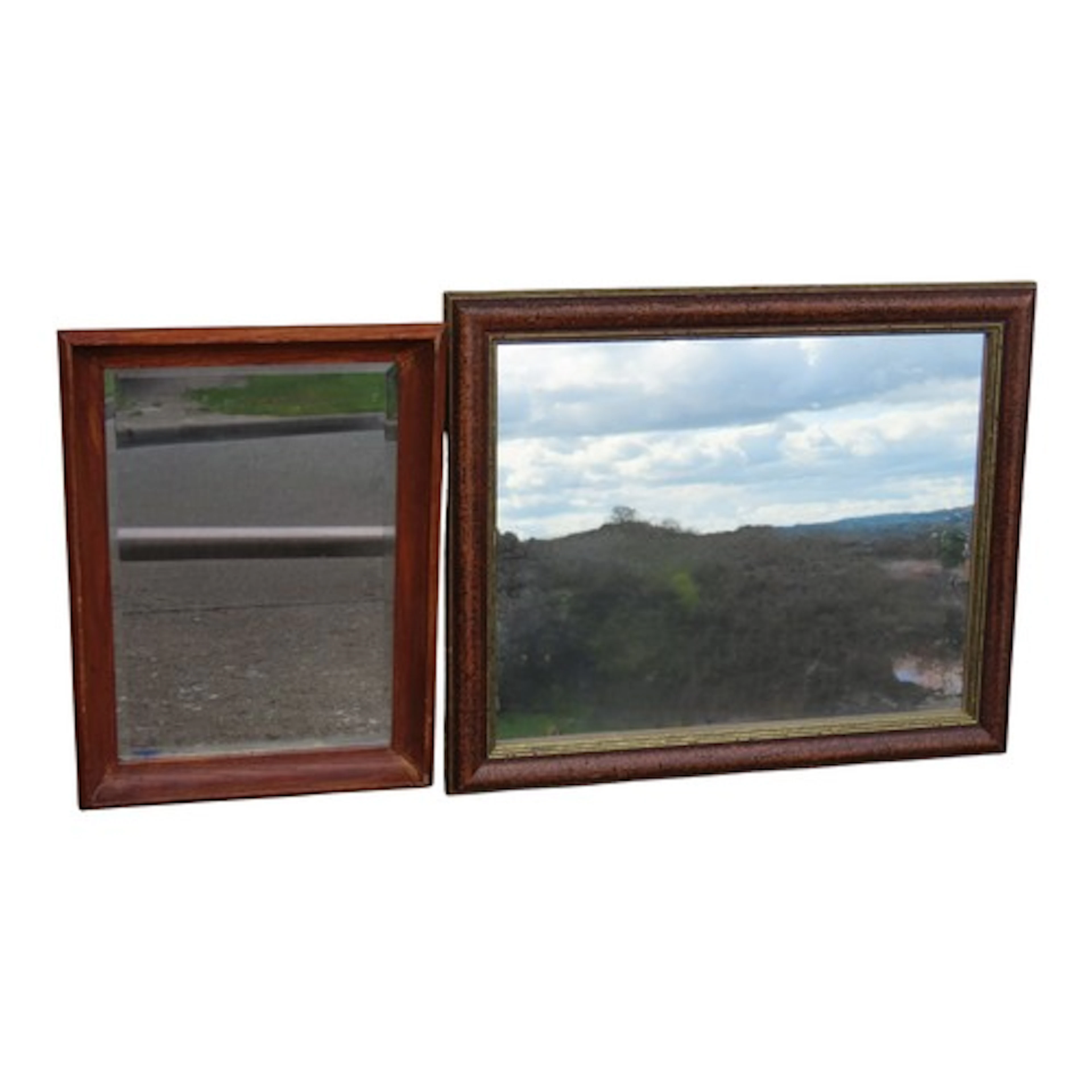 A small rectangular moulded oak framed wall mirror with beve...