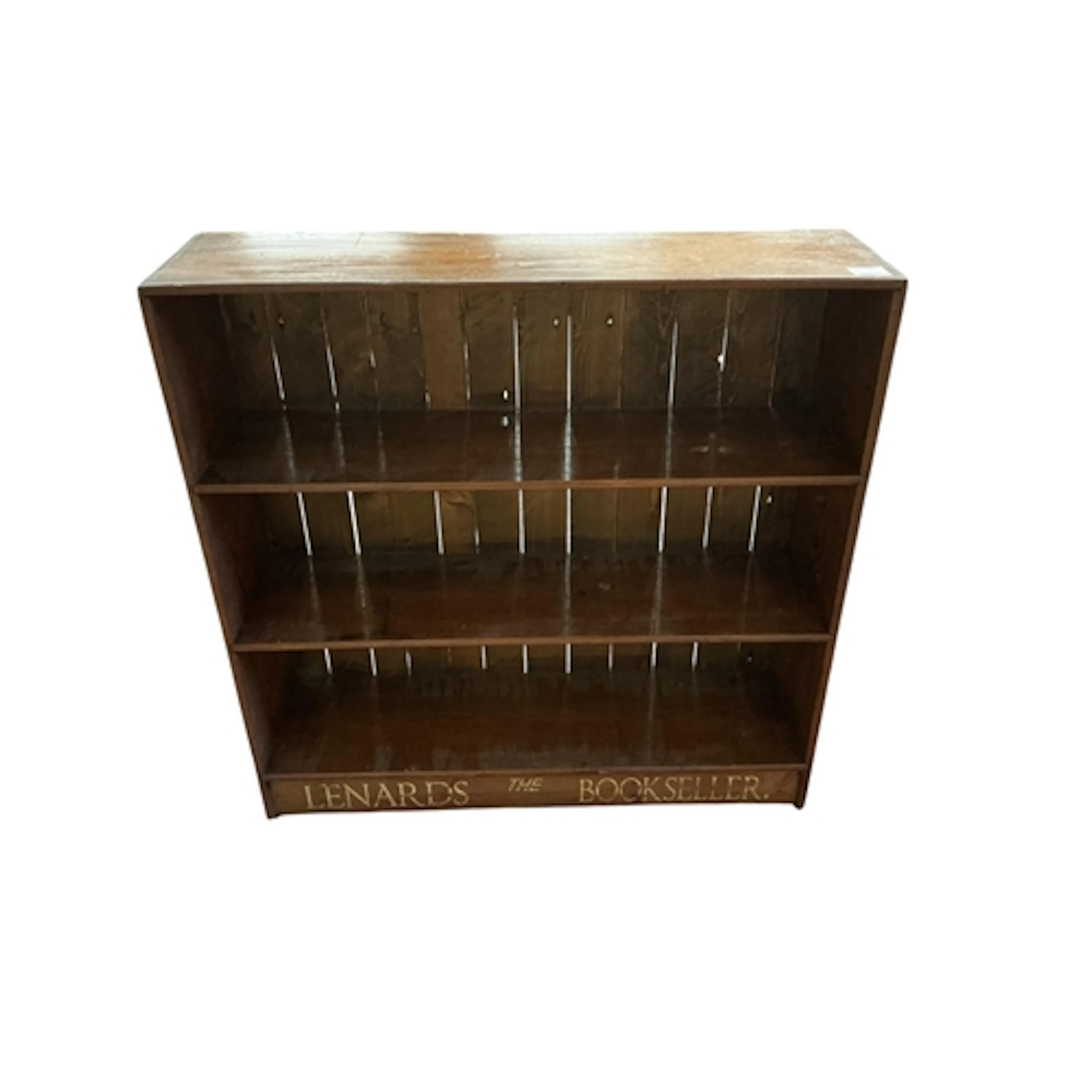 An early 20th century pine open bookcase with painted inscri...