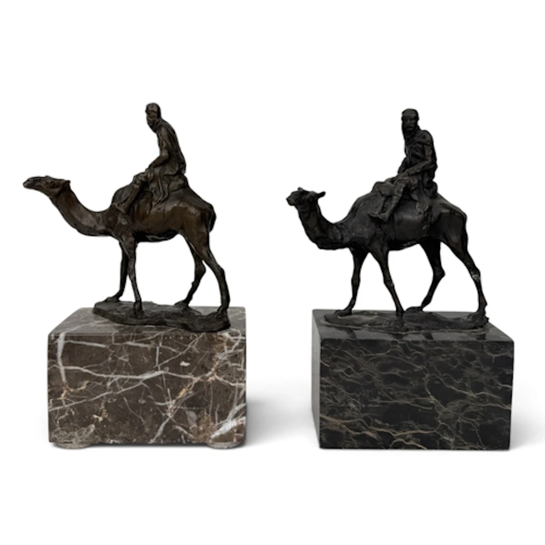 AFTER ANTIONE LOUIS BARYE: A BRONZE SCULPTURE OF A CAMEL AND...
