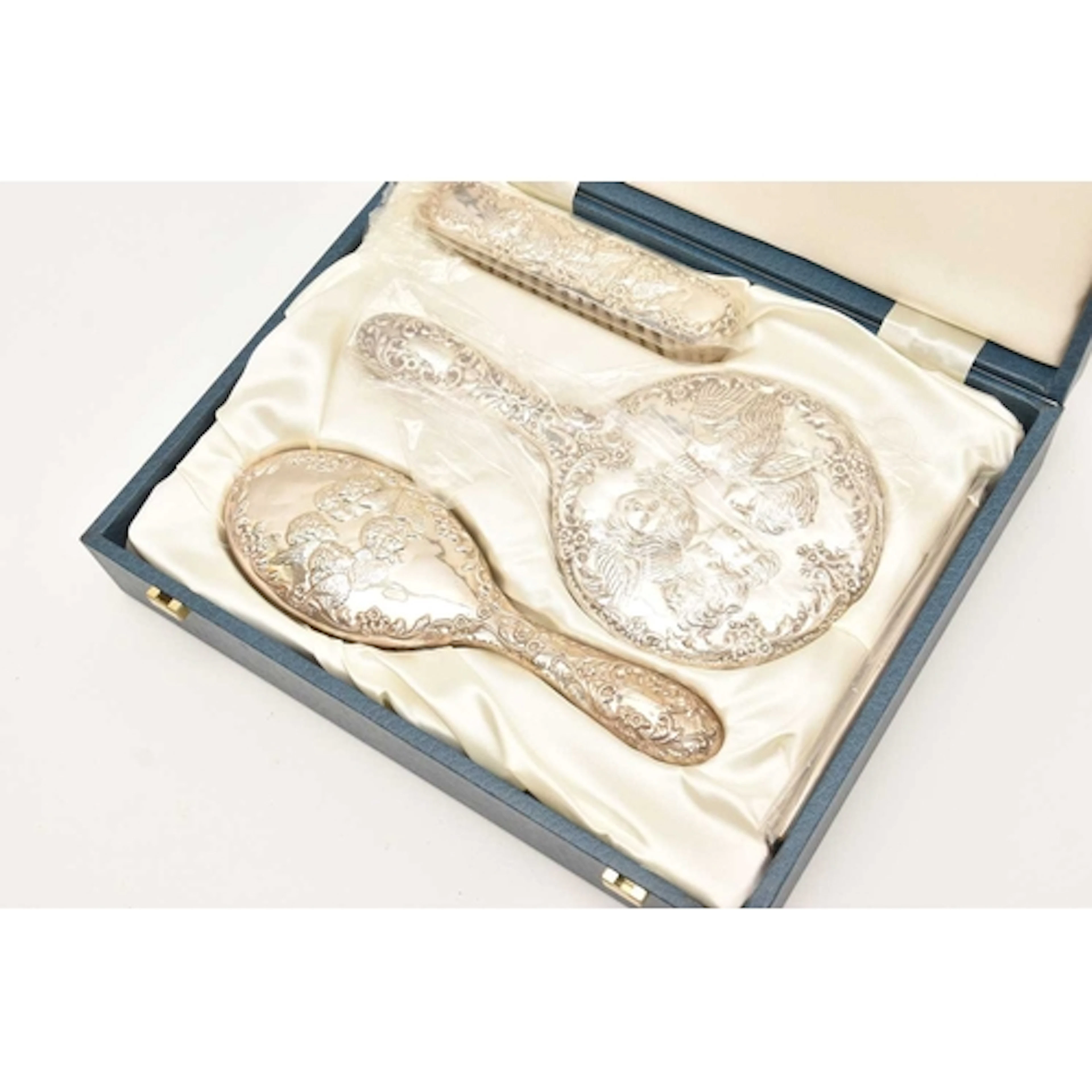 A CASED ELIZABETH II SILVER DRESSING TABLE SET, comprising o...