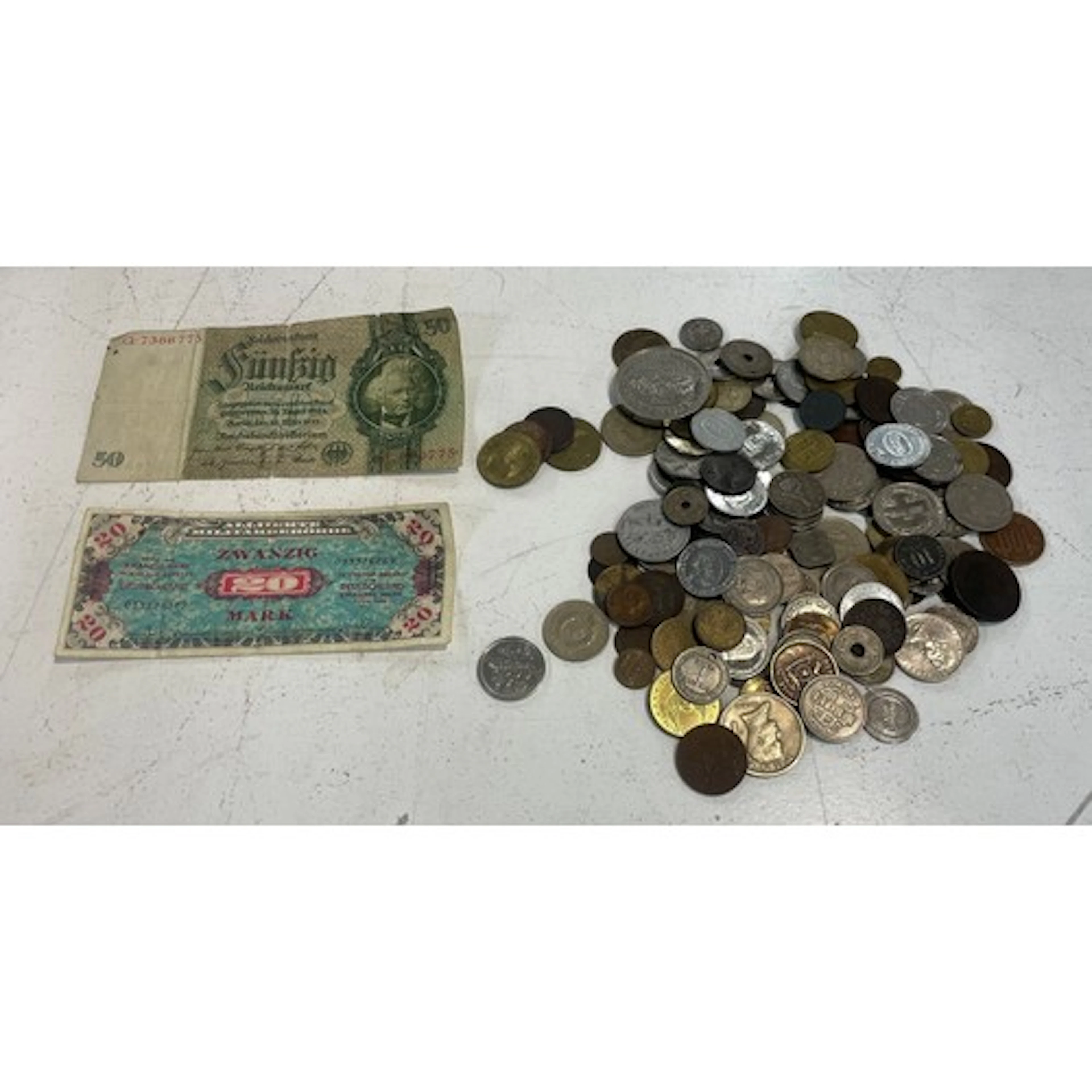 A collection of world coins and bank notes to include coins ...