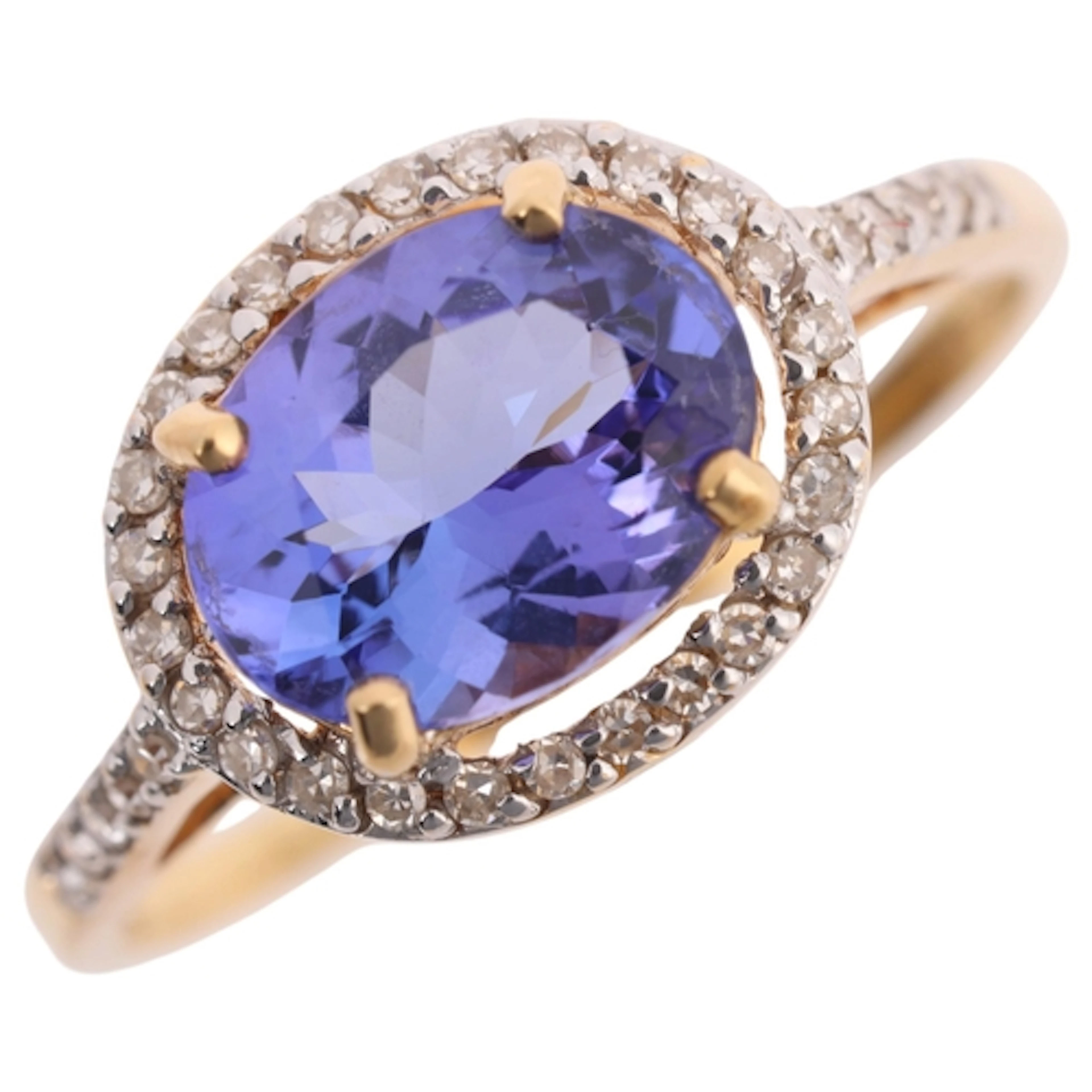 An 18ct gold tanzanite and diamond cluster ring, claw set wi...