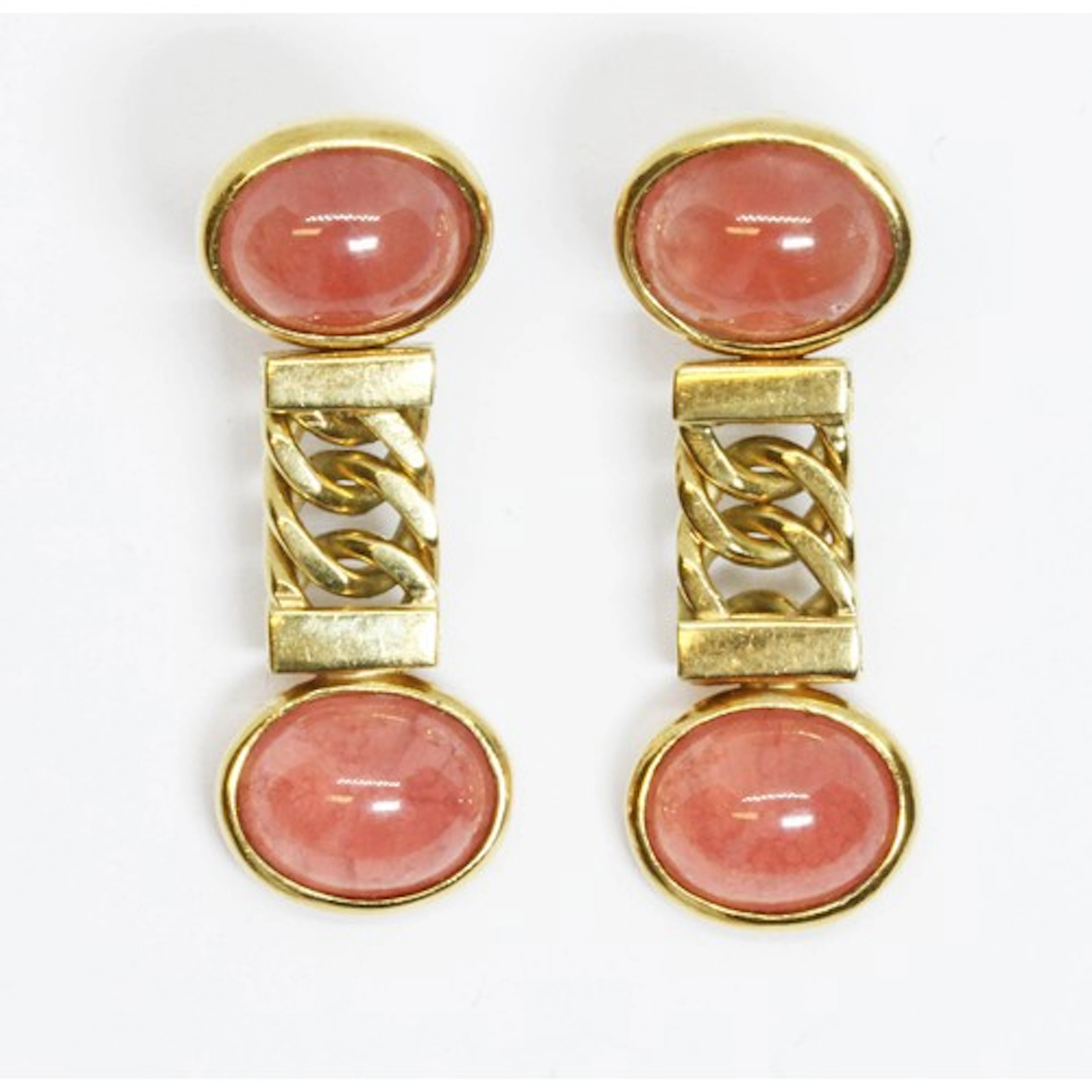 A pair of rhodochrosite cabochon earrings, the bezel set pin...