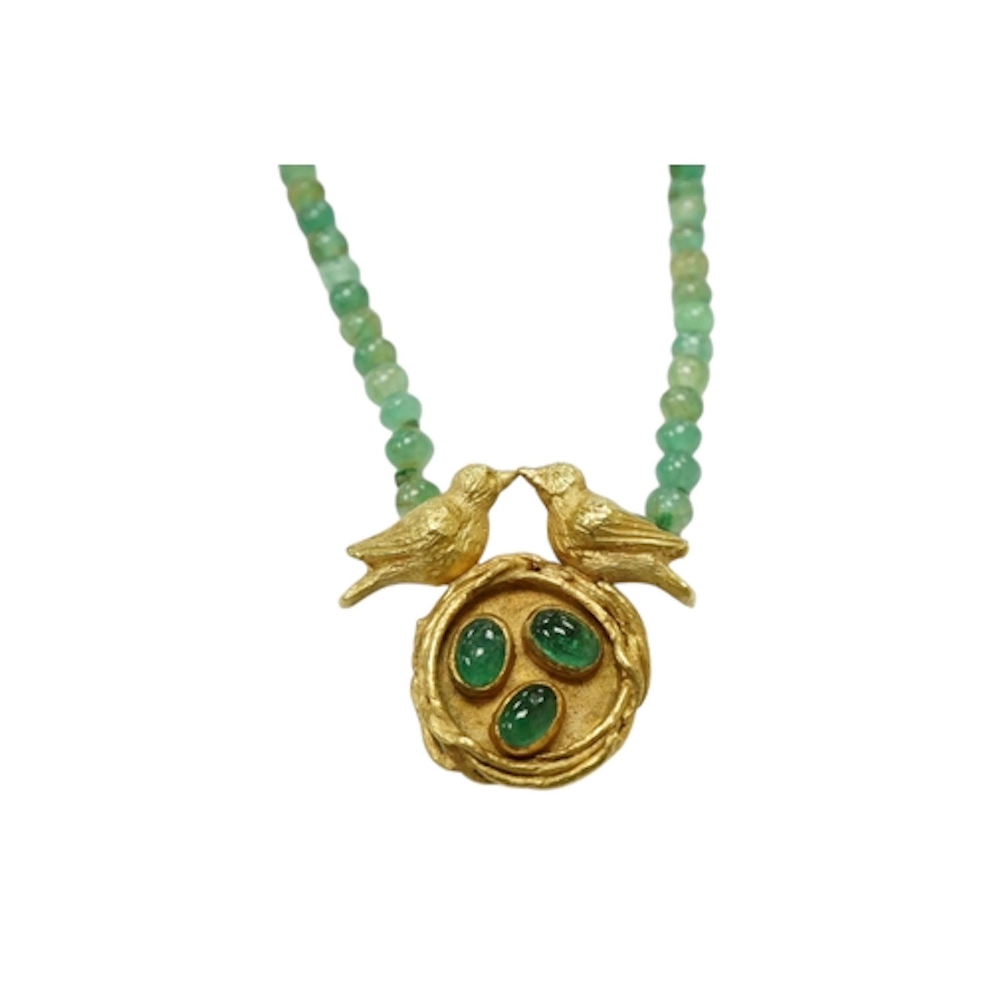 A recent 18ct gold and three stone cabochon emerald set pend...