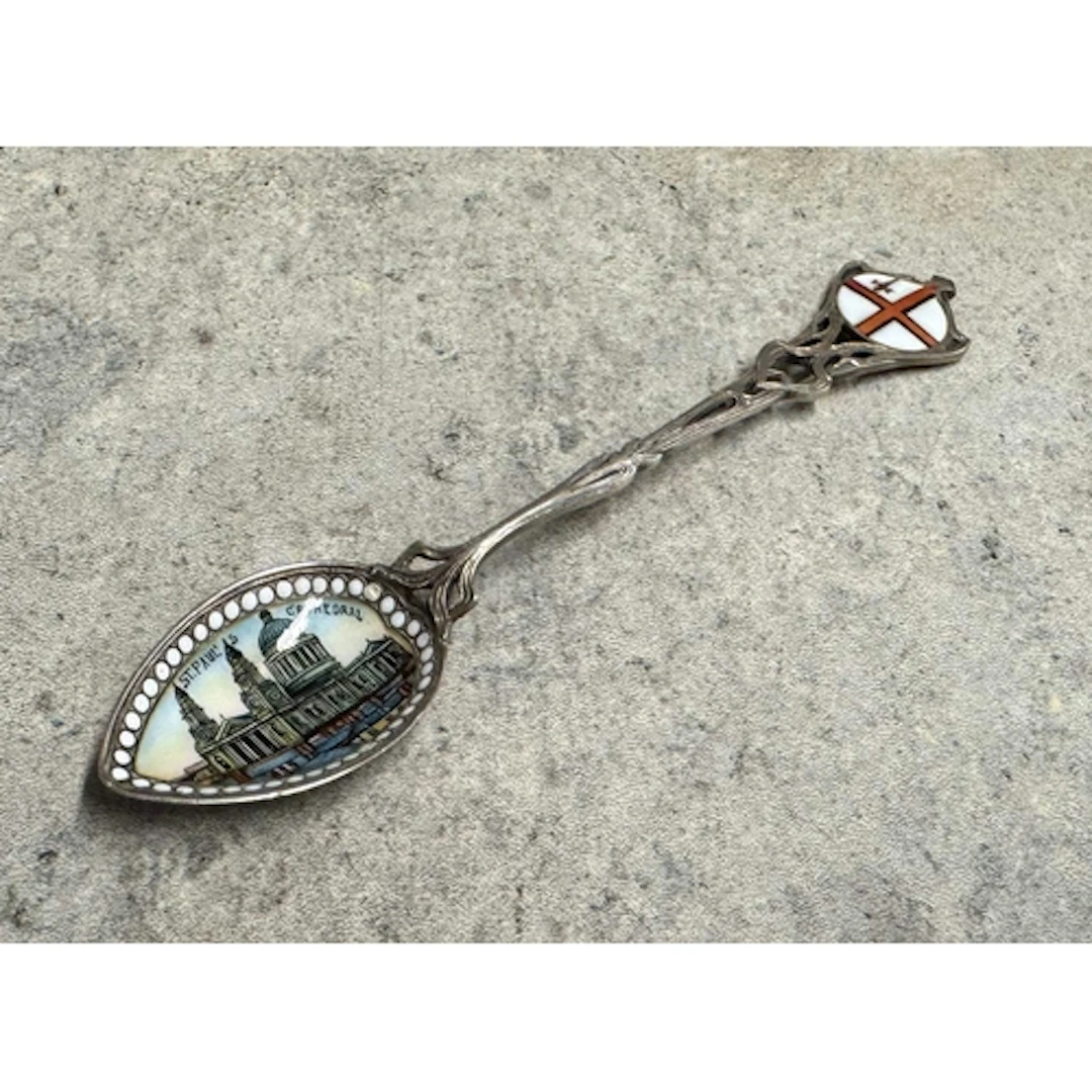 A silver and enamelled spoon depicting St Paul’s Cathedral. ...
