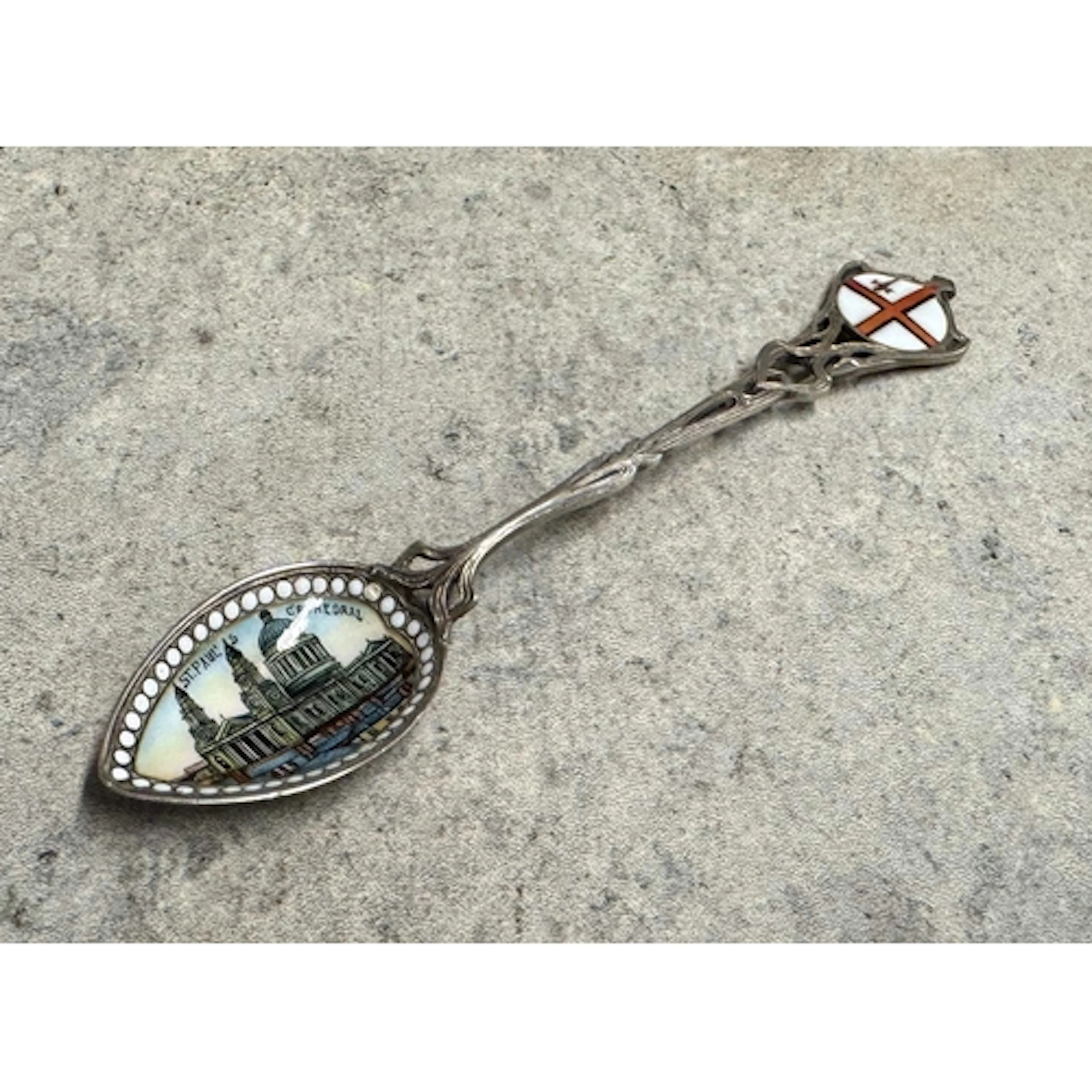 A silver and enamelled spoon depicting St Paul’s Cathedral. ...