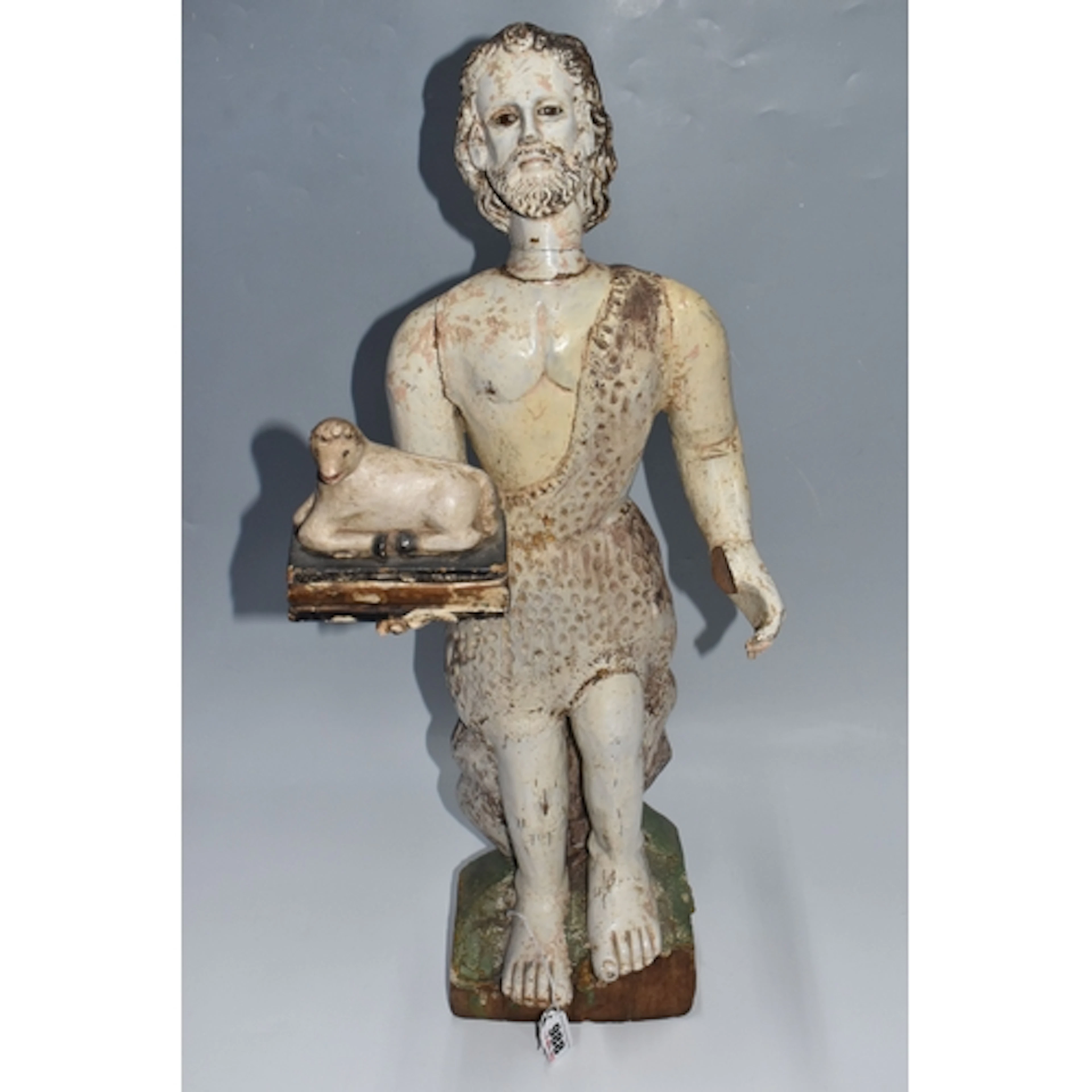 A LARGE POLYCHROME 'JOHN THE BAPTIST' WOODEN SCULPTURE depic...