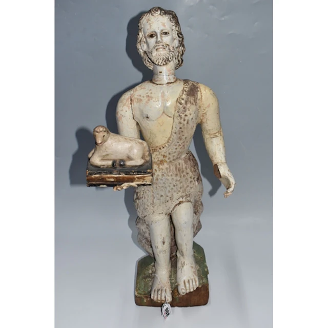 A LARGE POLYCHROME 'JOHN THE BAPTIST' WOODEN SCULPTURE depic...