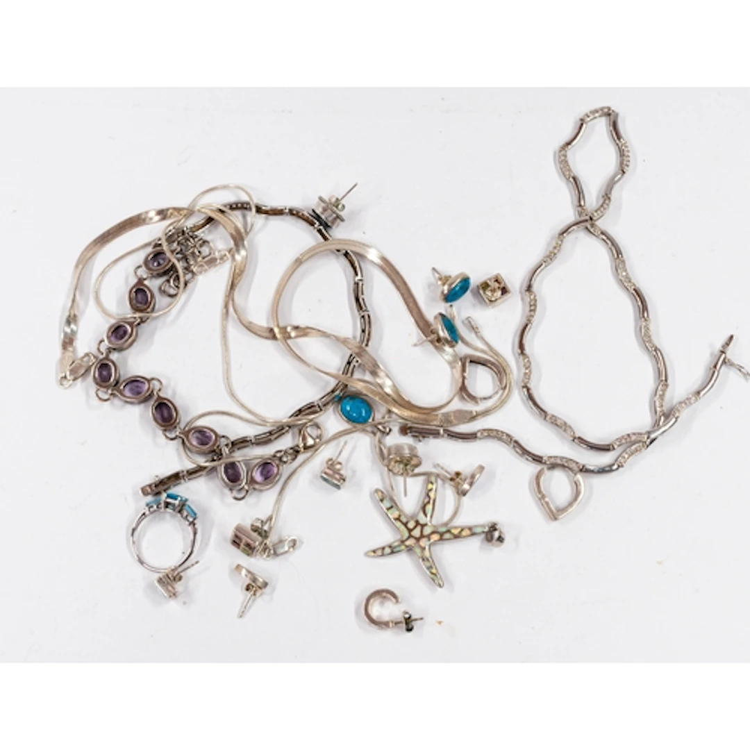 Jewellery: a collection of silver and white metal jewellery,...