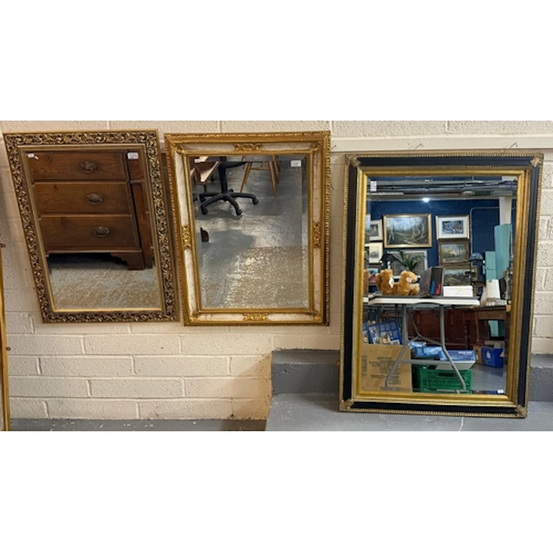 Three modern gilt framed rectangular mirrors each with bevel...